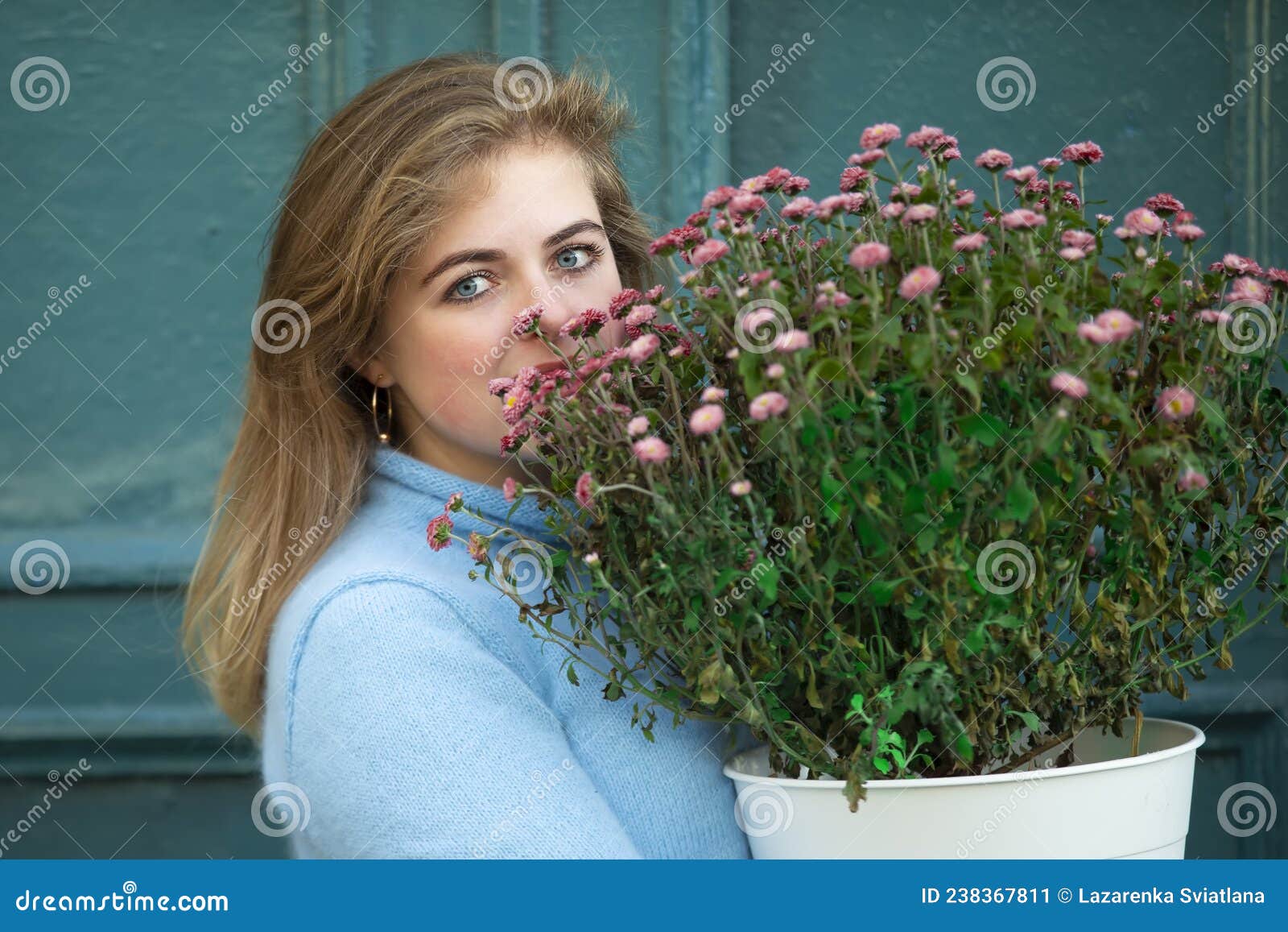 A Beautiful Girl Is Holding A Large Bouquet Of Flowers Stock Image Image Of Hair Caucasian