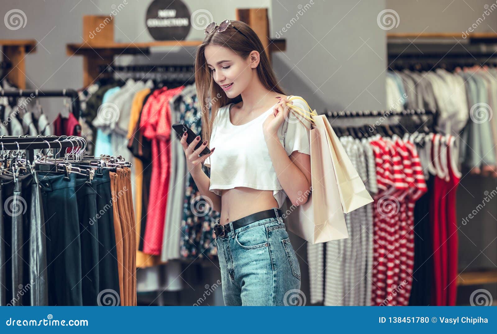 Beautiful Girl is Holding Shopping Bags in the Mall. Stock Photo ...