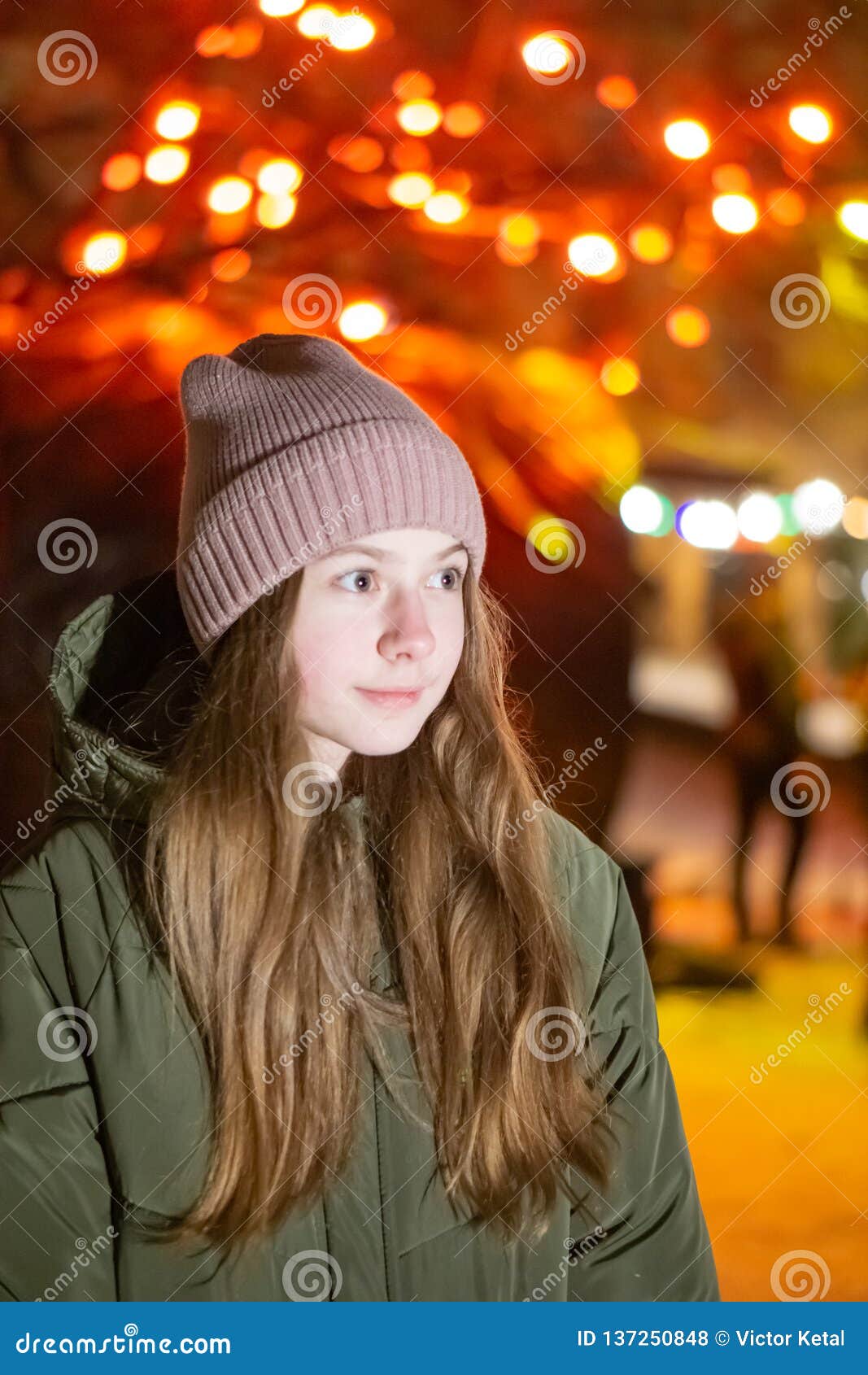 Beautiful Girl Looking Down on the Night City Street Against the ...