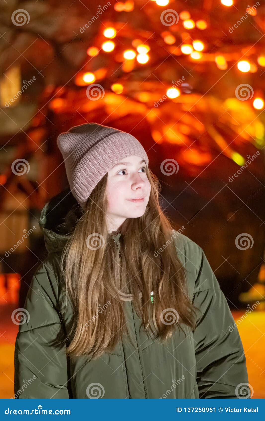 Beautiful Girl Looking Down on the Night City Street Against the ...