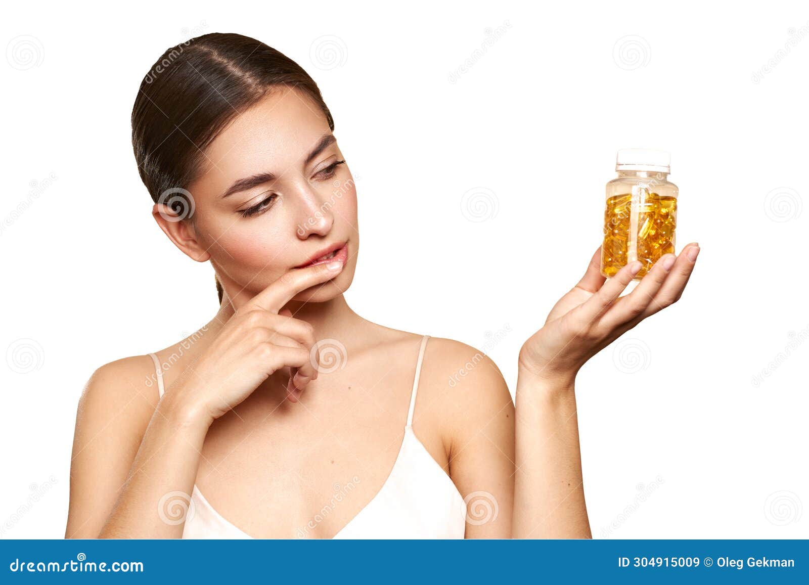 beautiful girl with pill with cod liver oil omega-3