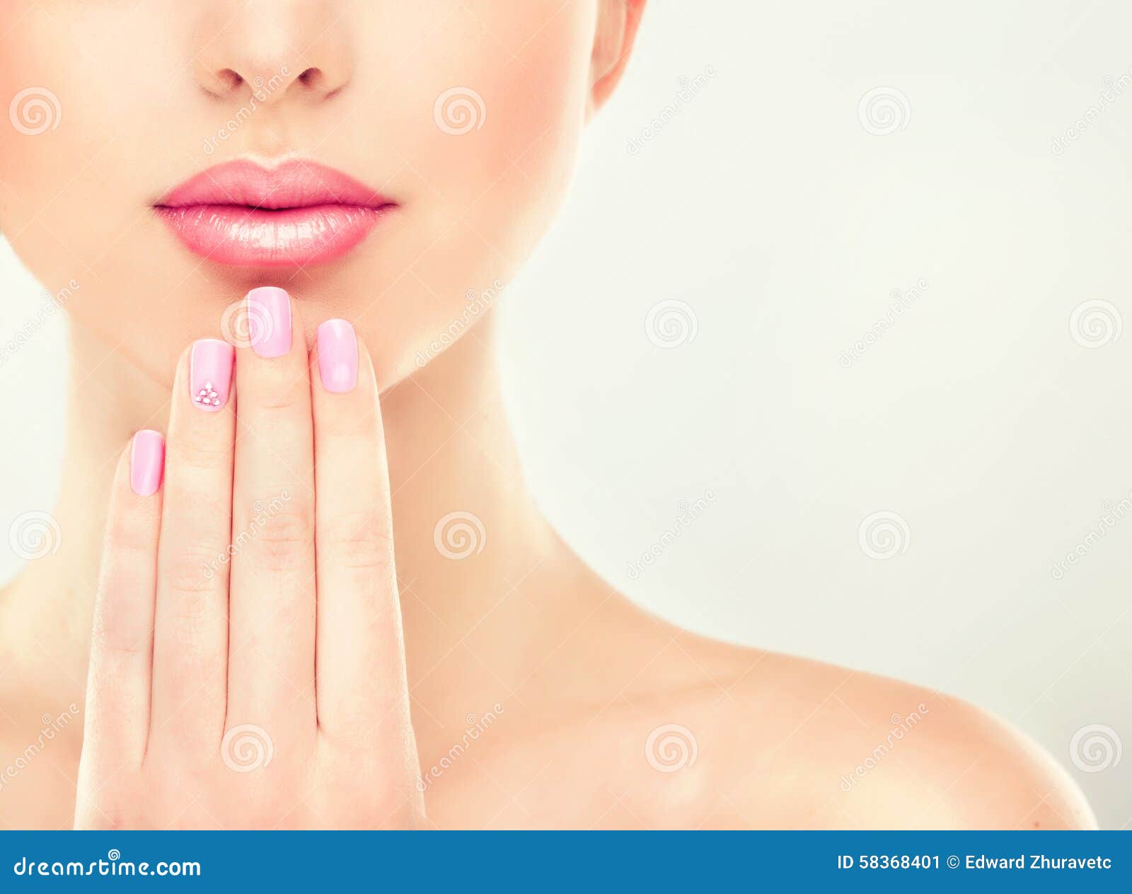 beautiful girl with pink manicure