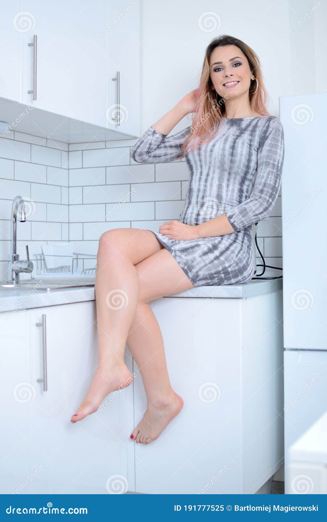 Sexy legs cooking in the kitchen