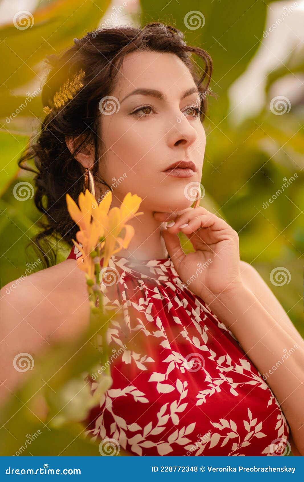 A Beautiful Girl In A Red Dress And With Earrings In The Rings In The Greenhouse Woman In