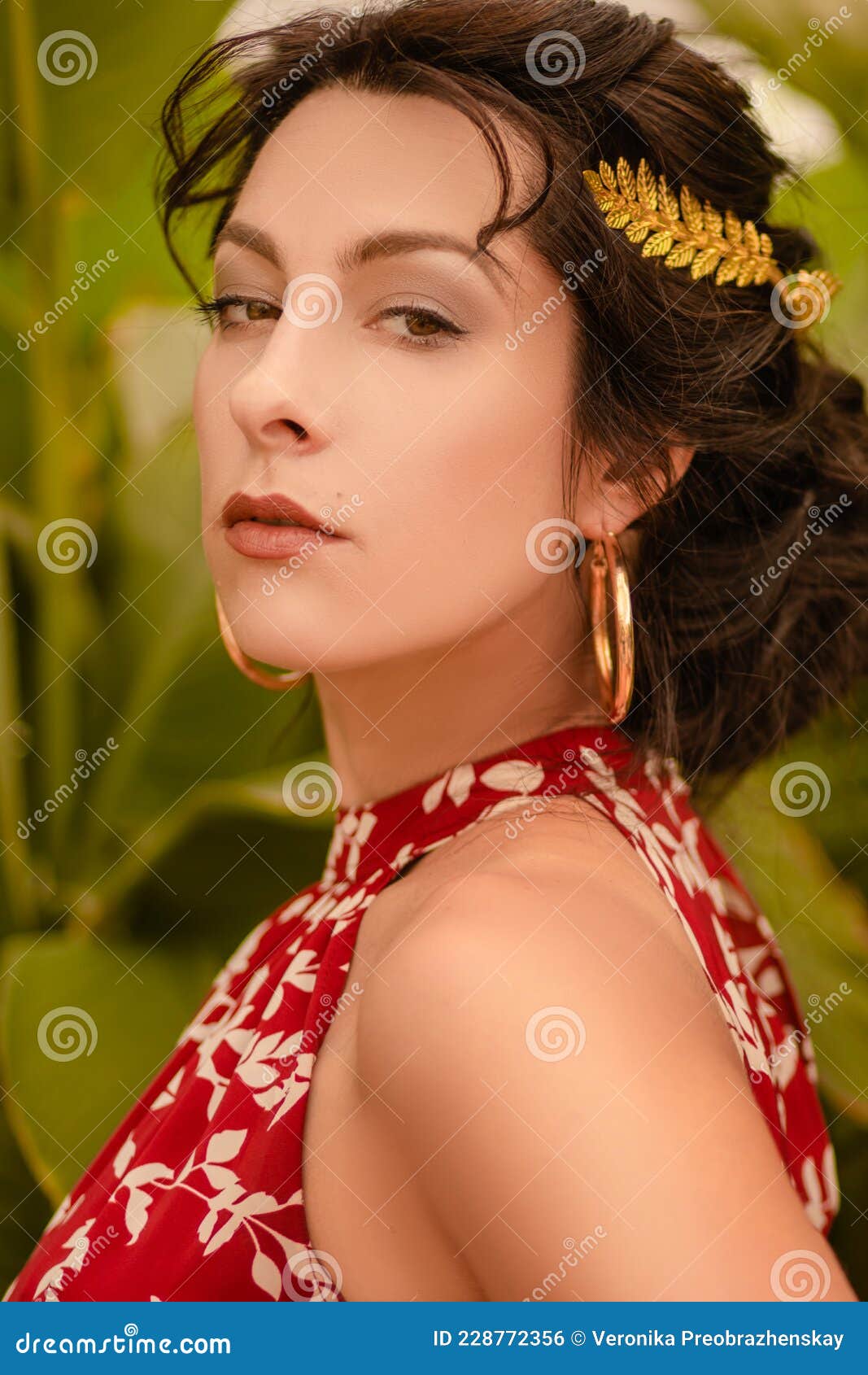 A Beautiful Girl In A Red Dress And With Earrings In The Rings In The Greenhouse Woman In