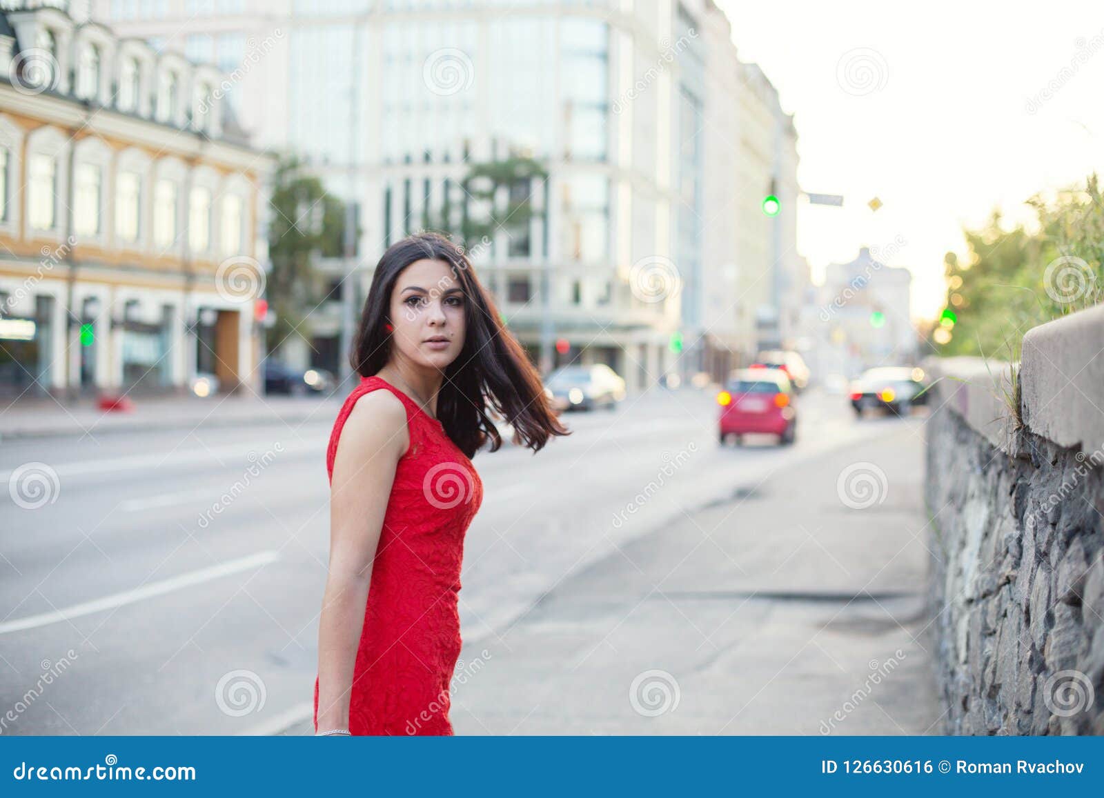 Beautiful Girl in a Red Dress is Standing Near of the Roadway. Stock ...