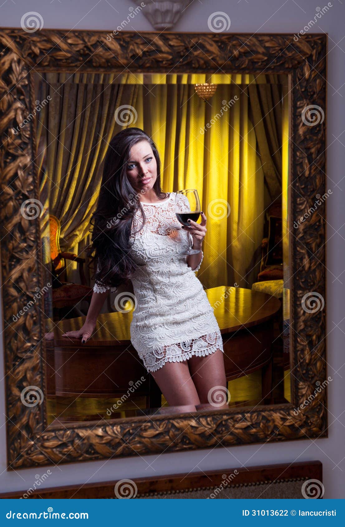 The Beautiful Girl In A Short White Dress Looking Into 