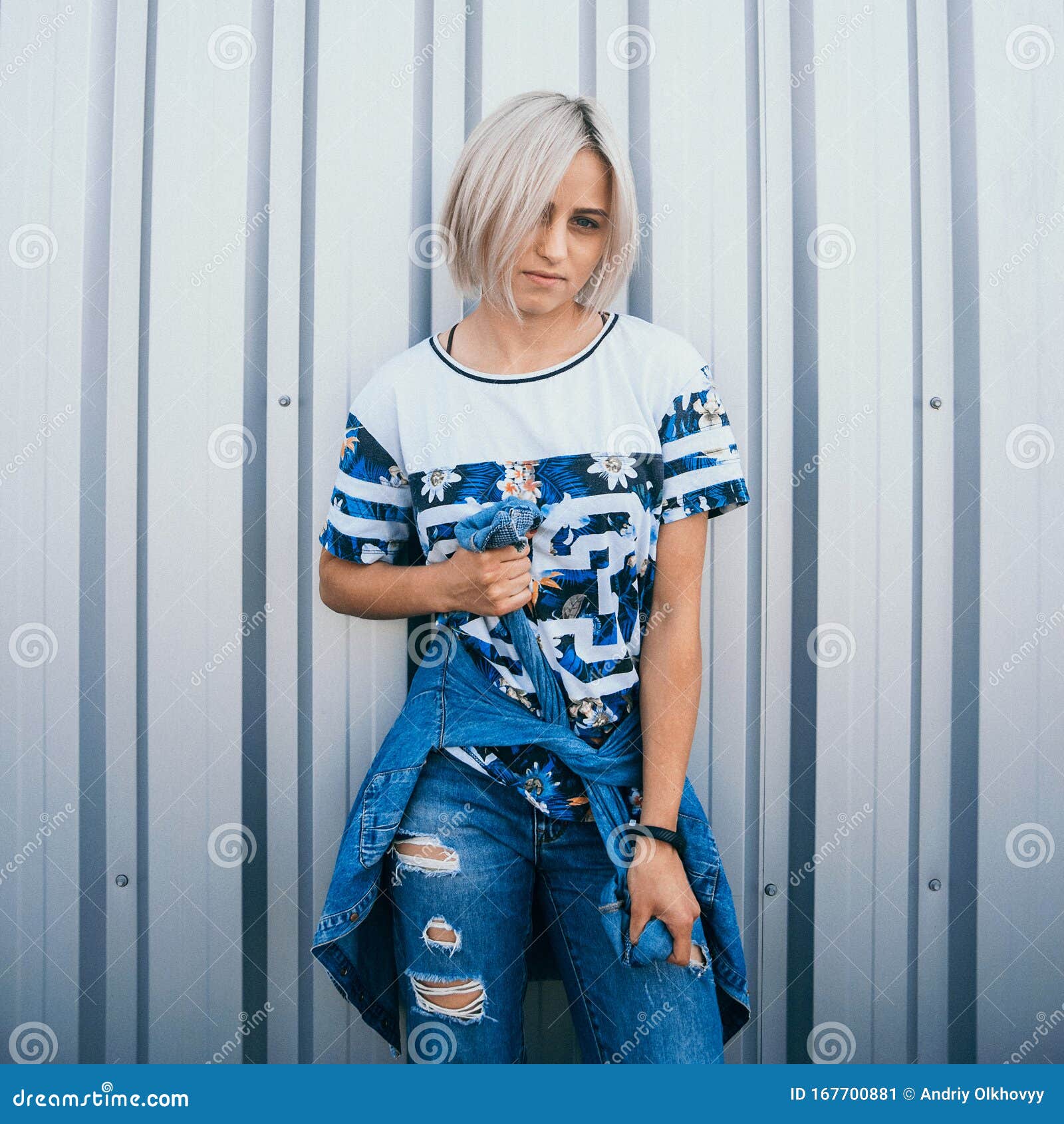 Beautiful Girl with Short White Hair Dressed in Jeans in Urban Style Stands  on the Background of a White Wall. Her Hair Cover Half Stock Image - Image  of hairstyle, beautiful: 167700881