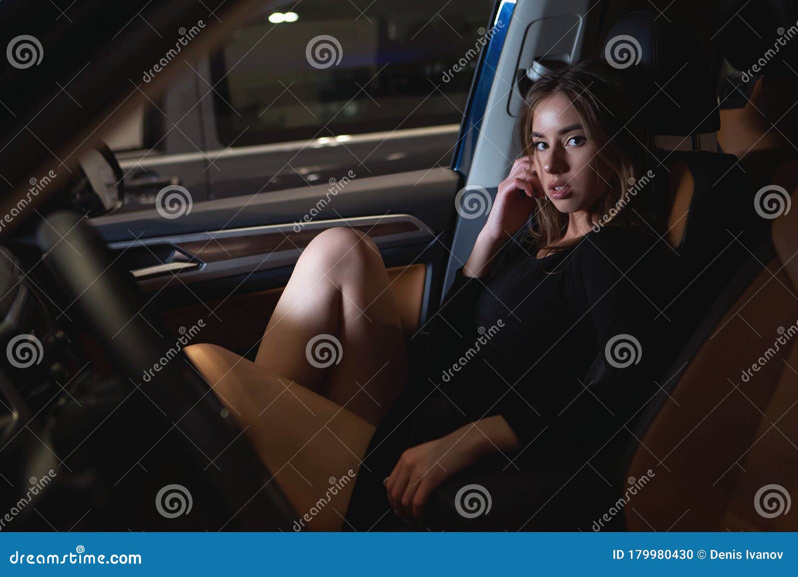 beautiful girl in the salon of a prestigious car