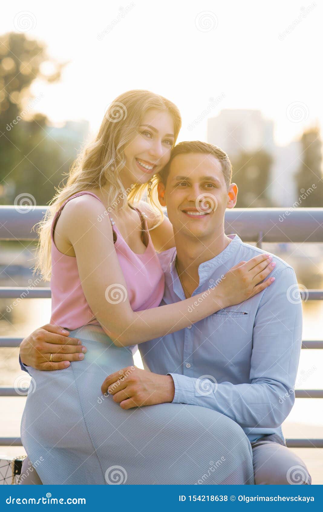 Girl Sitting On Boy Lap