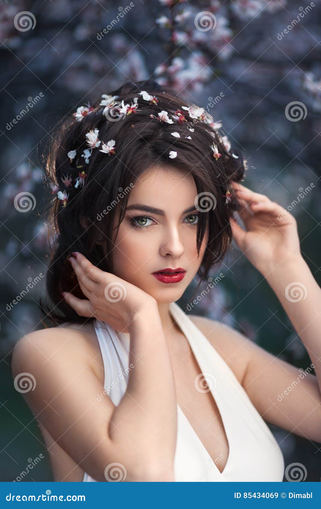 Beautiful Girl Standing At Blossoming Tree In The Garden Stock Image
