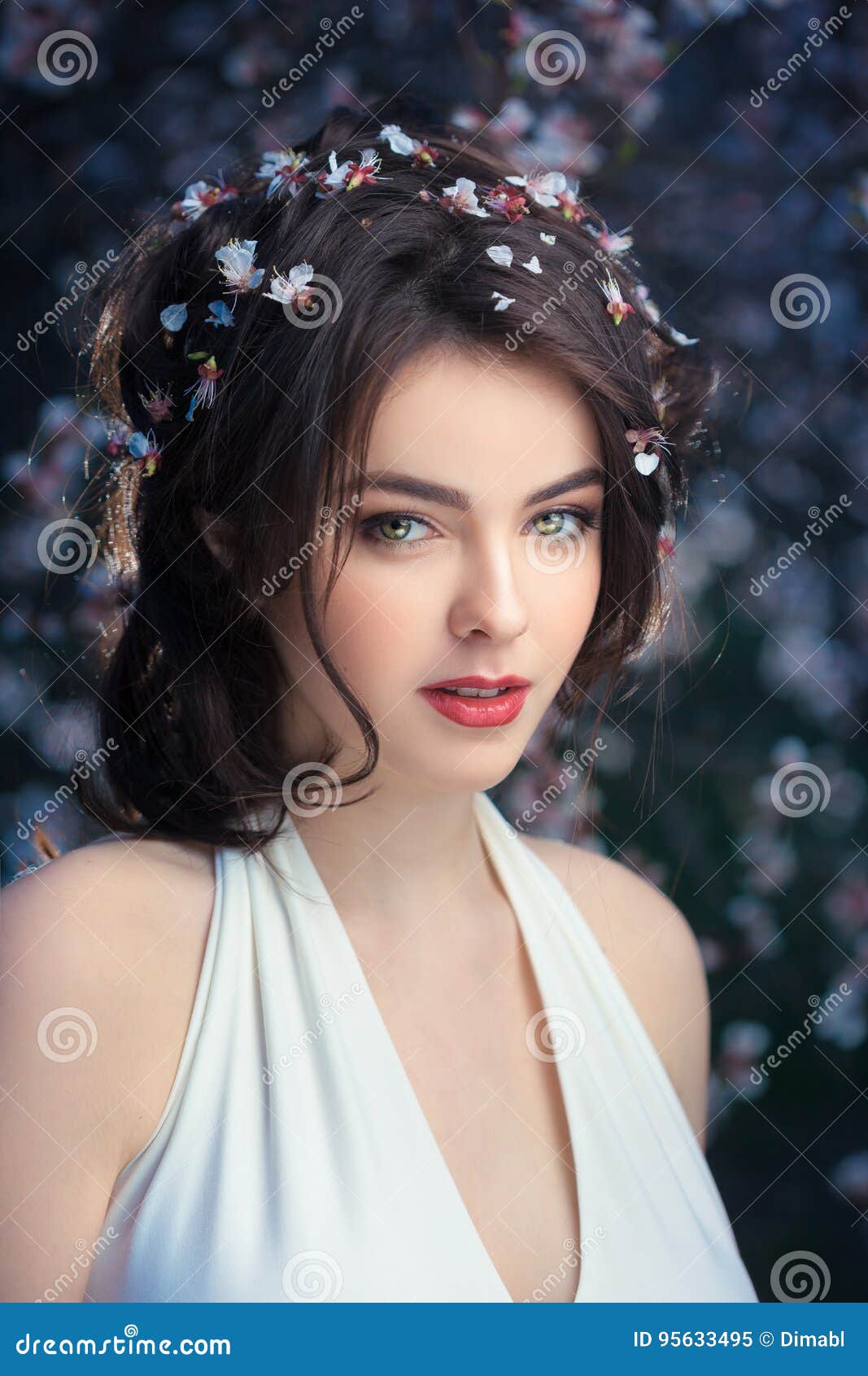 Beautiful Girl Standing At Blossoming Tree In The Garden Stock Image