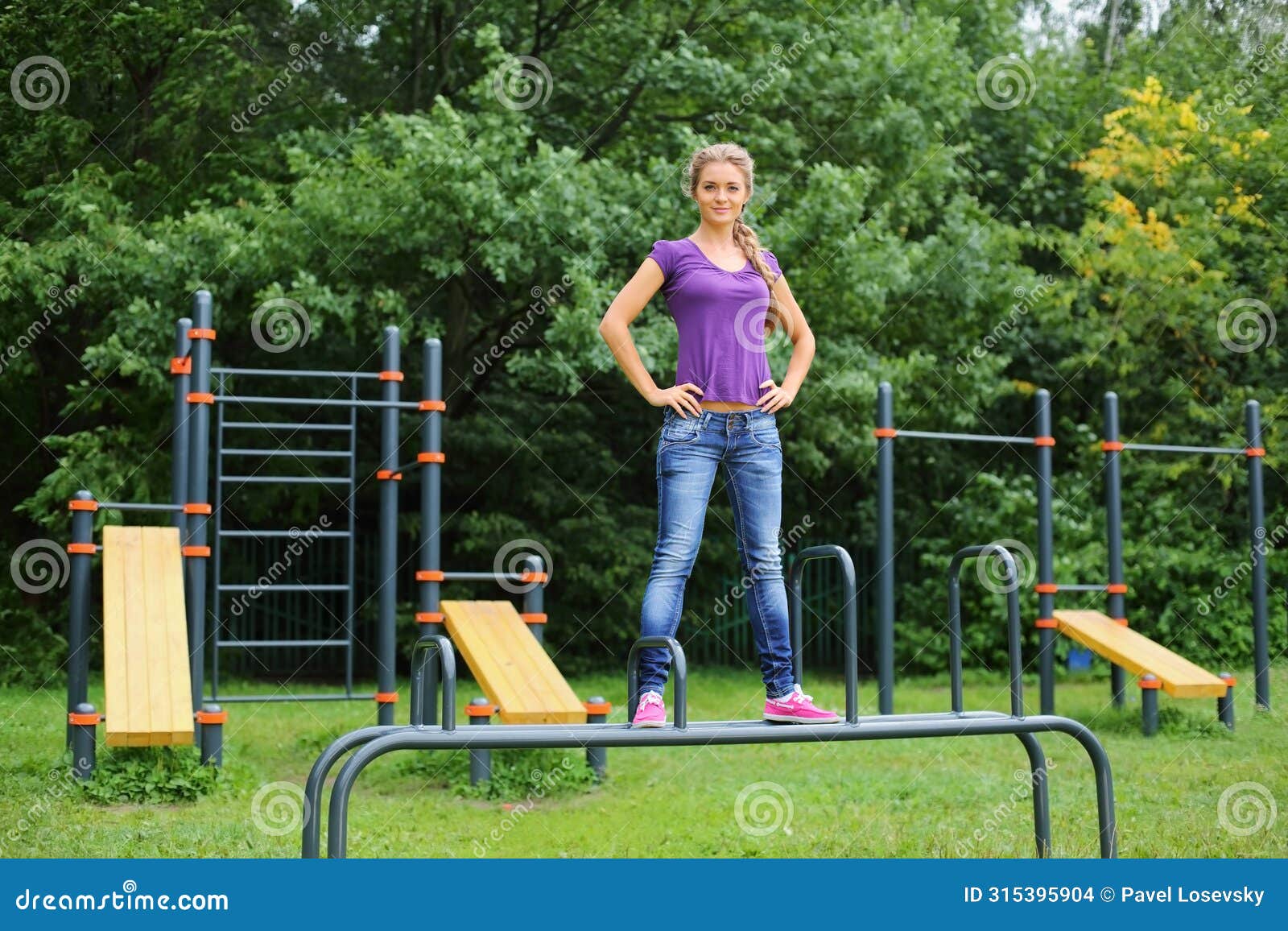 beautiful girl standing on the parallel