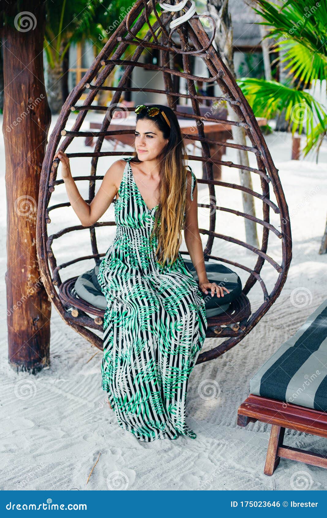 Beautiful Girl In Sunglasses In A Bright Dress On A White