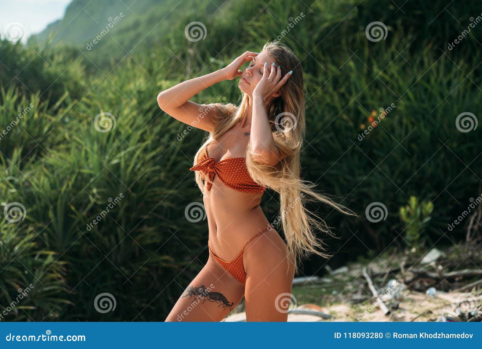 A Beautiful Girl with a Thin Waist and Long Legs, a Big Breast Rests on the  Sea in a Fashionable Swimsuit. the Model Stock Photo - Image of outdoors,  relax: 118093280