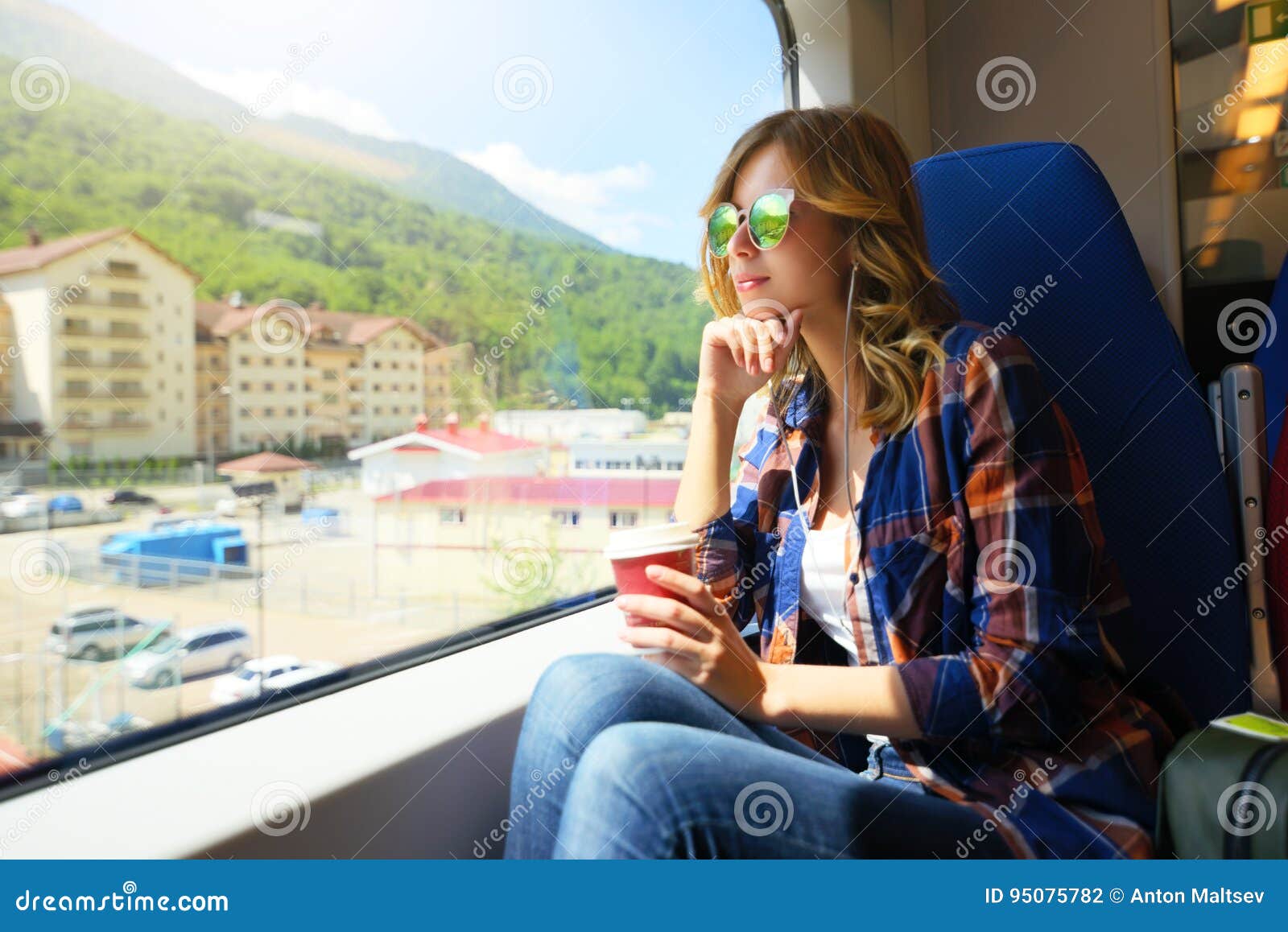 beautiful girl travelling on train. rosa khutor