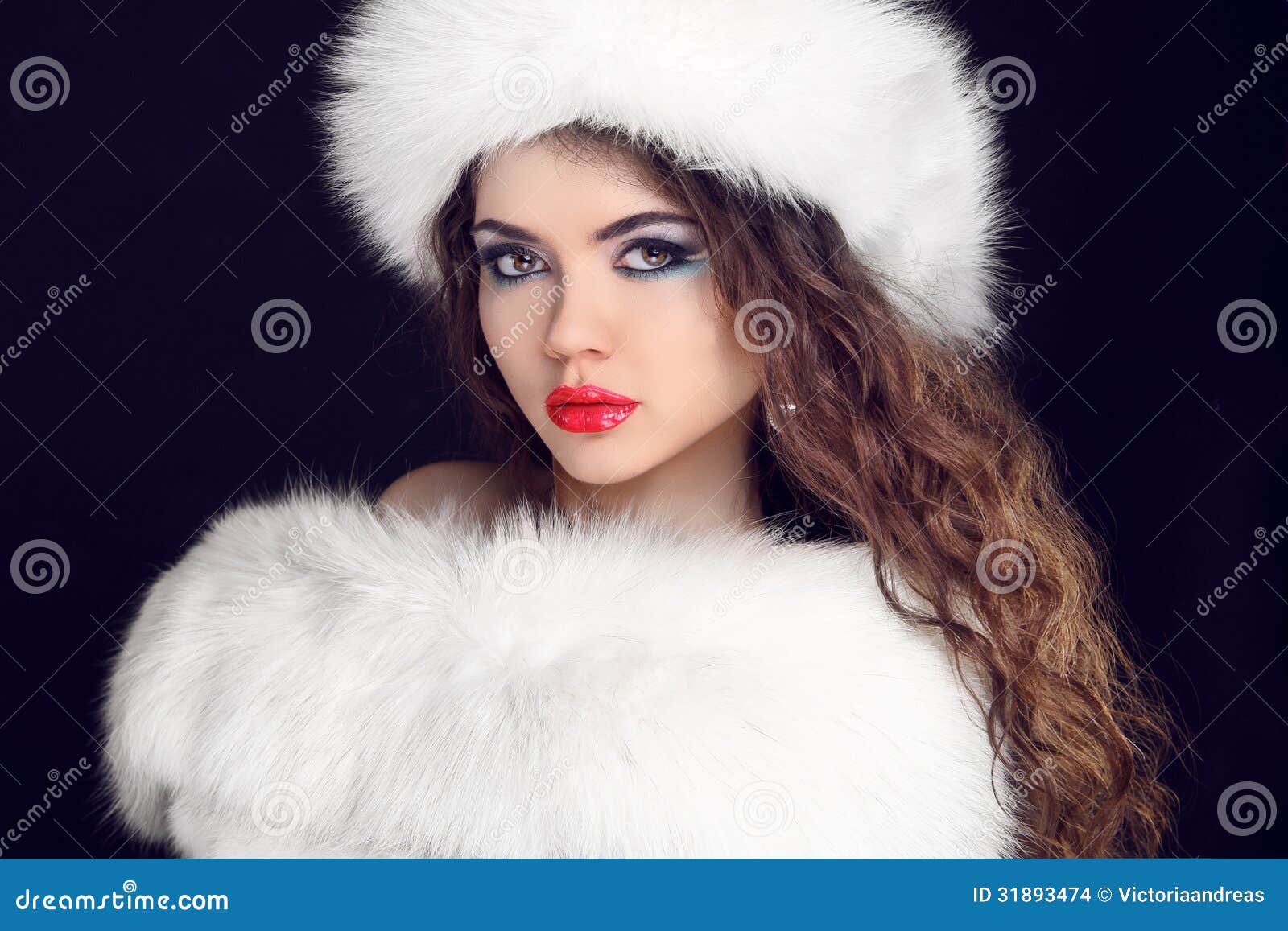 beautiful girl wearing in white fur coat and furry hat. winter w