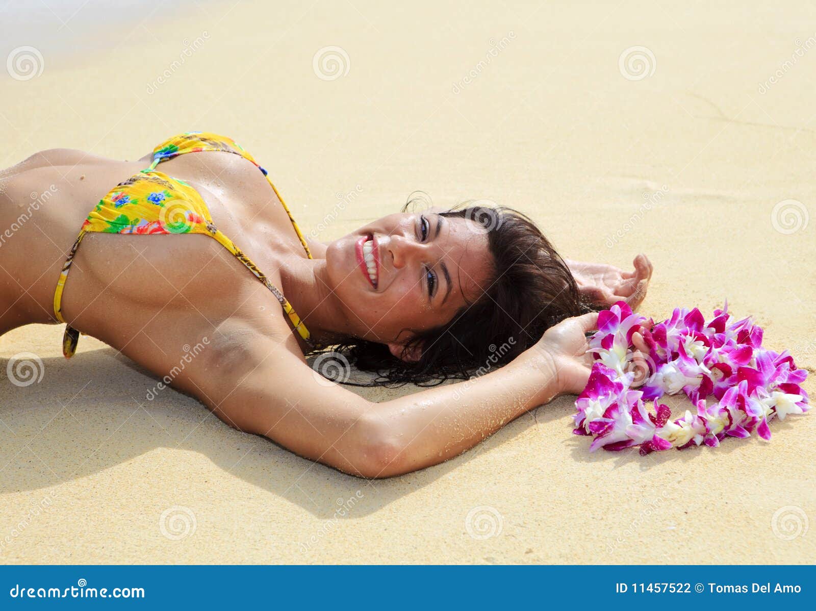 Beautiful Girl in a Yellow Bikini Stock Photo