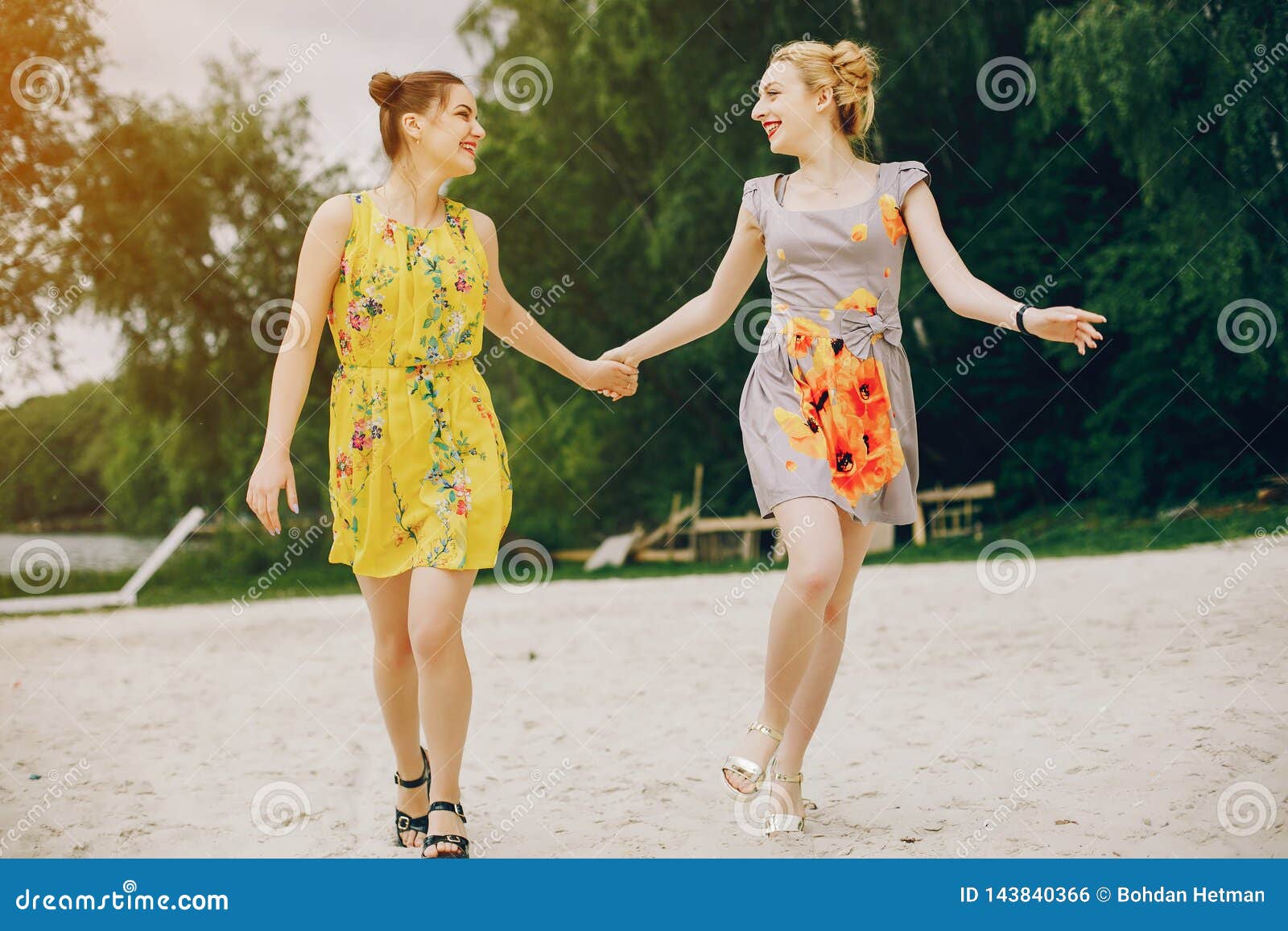 Two Pretty Girls in a Summer Park Stock Photo - Image of dress, girls ...