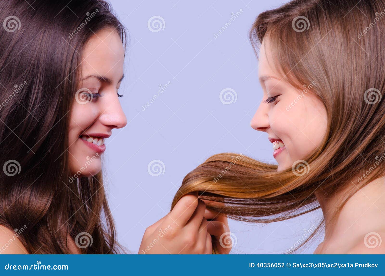 Beautiful Girls Playing with Their Hair Stock Photo - Image of beautiful,  female: 40356052