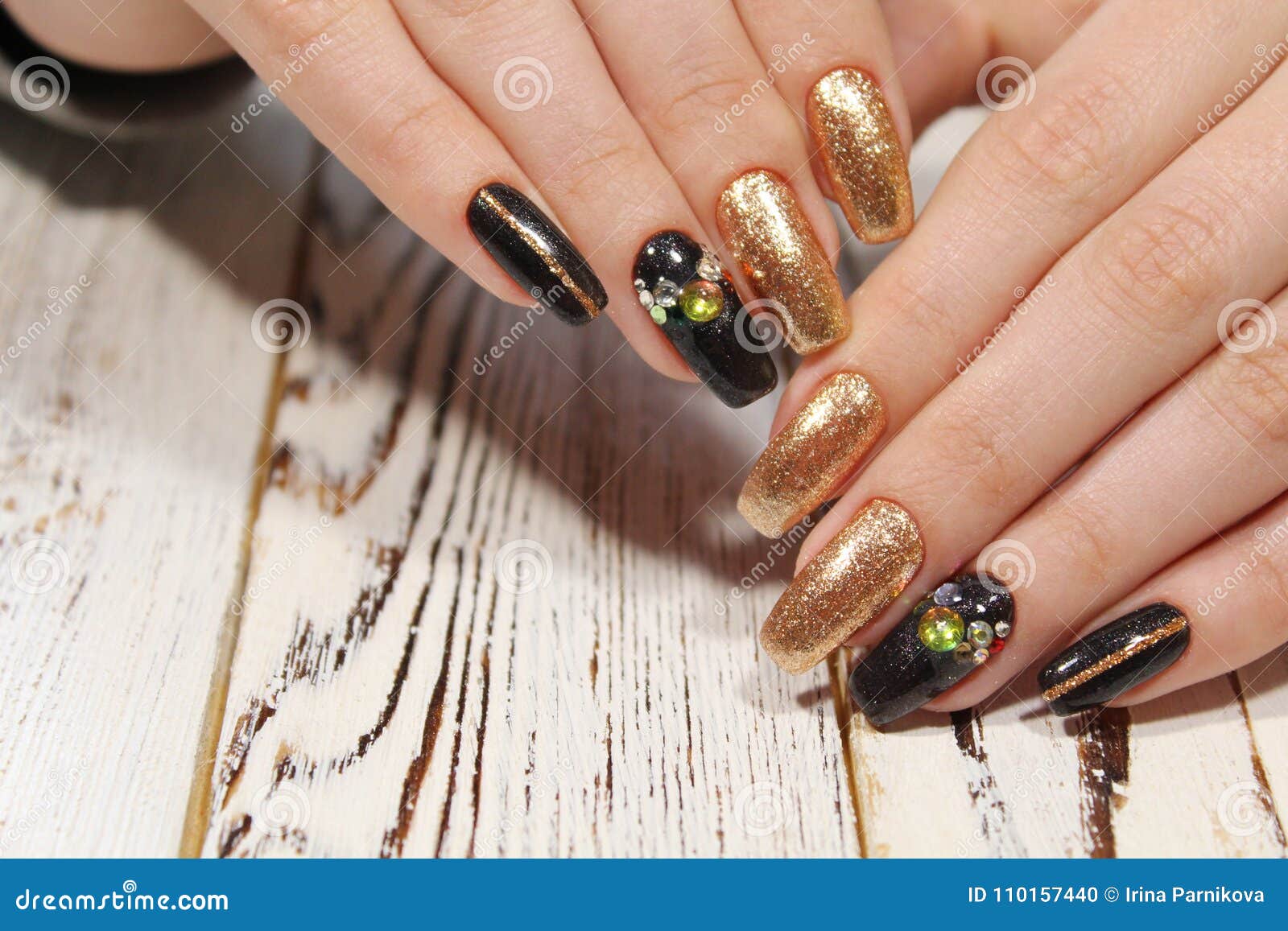 Beautiful golden manicure stock photo. Image of model - 110157440