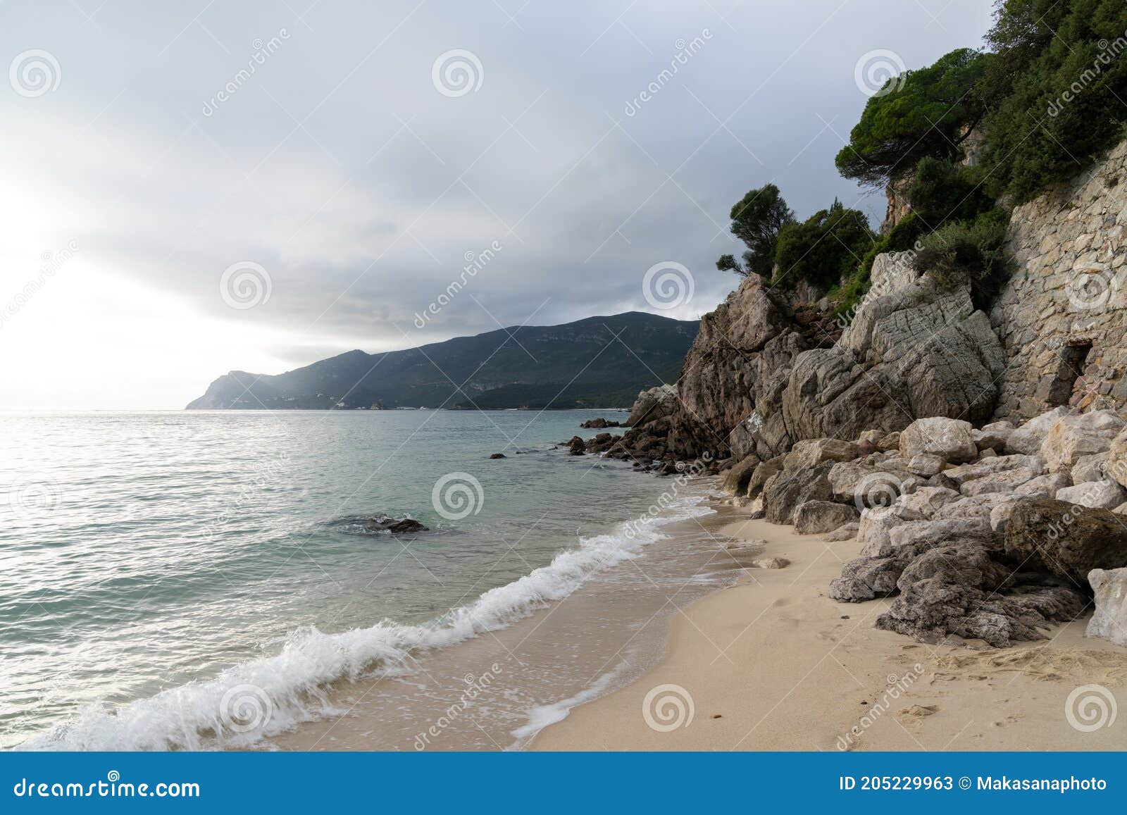 praia da figueirinho beach on the costa azul in southern portugal