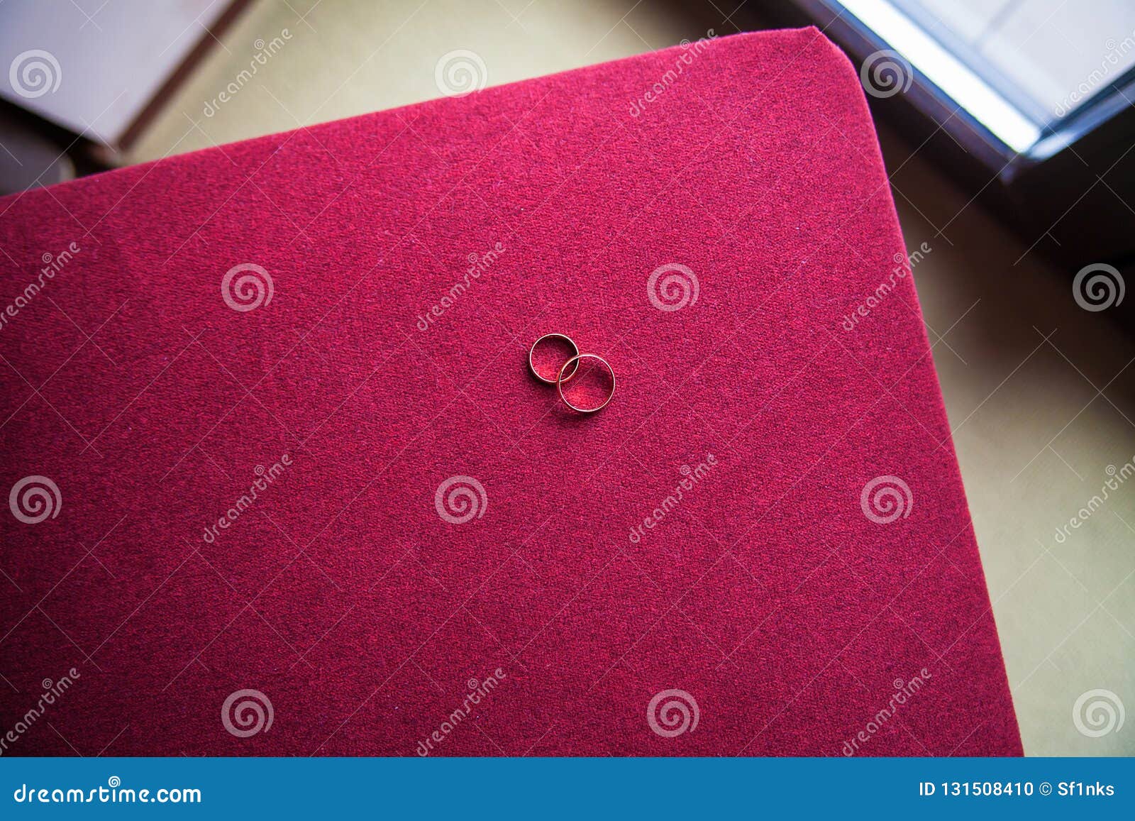 Beautiful Golden Wedding Ring on a Red Couch Stock Photo Image of