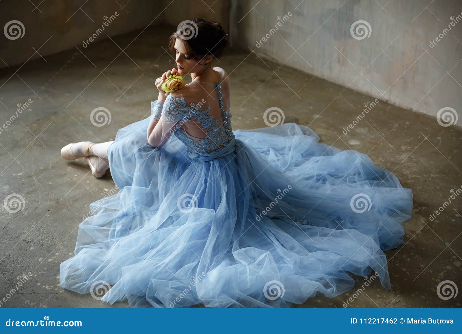 Beautiful Graceful Girl Ballerina in a Blue Dress and Pointe Sit Stock ...