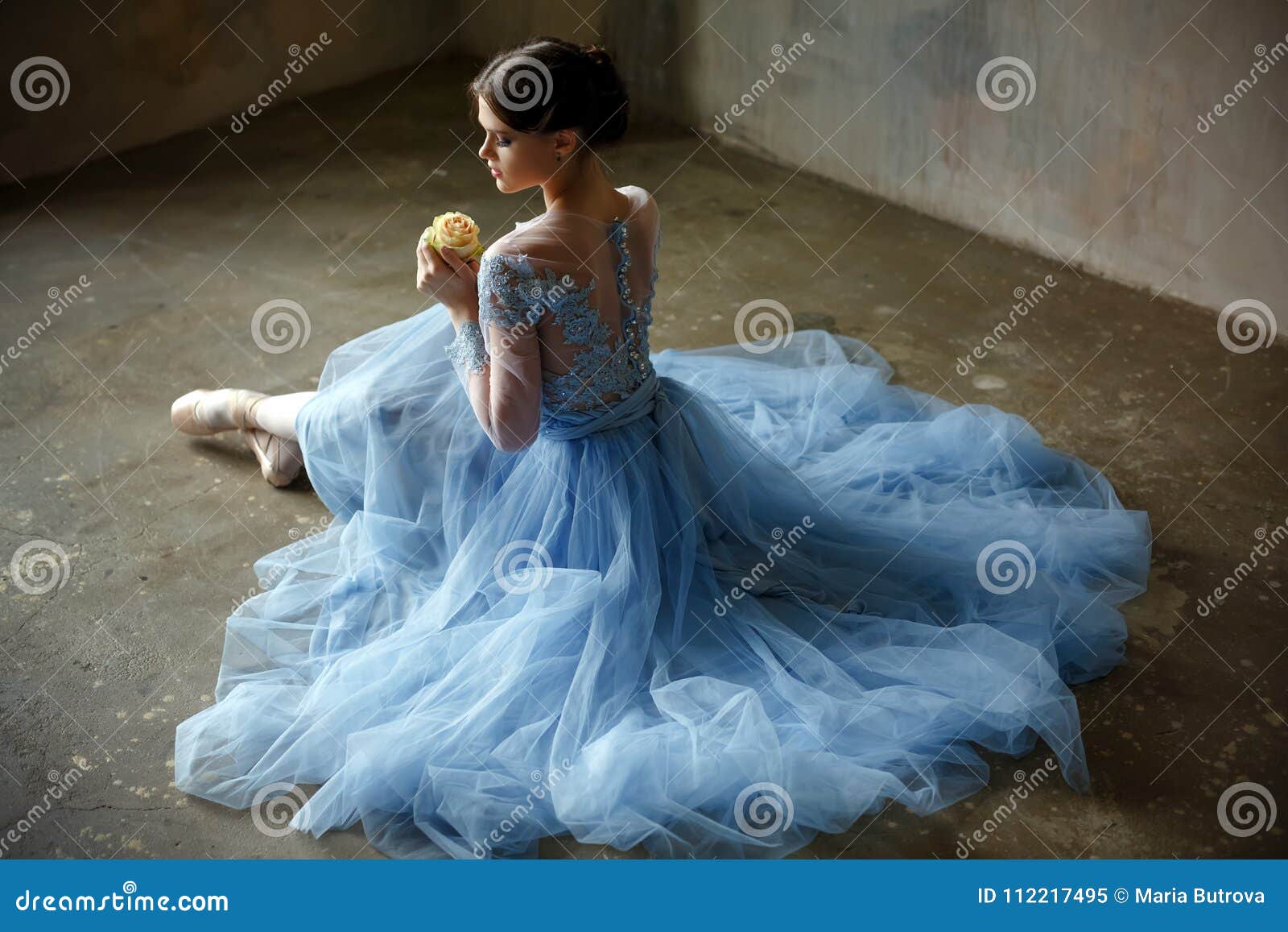 Beautiful Graceful Girl Ballerina in a Blue Dress and Pointe Sit Stock ...