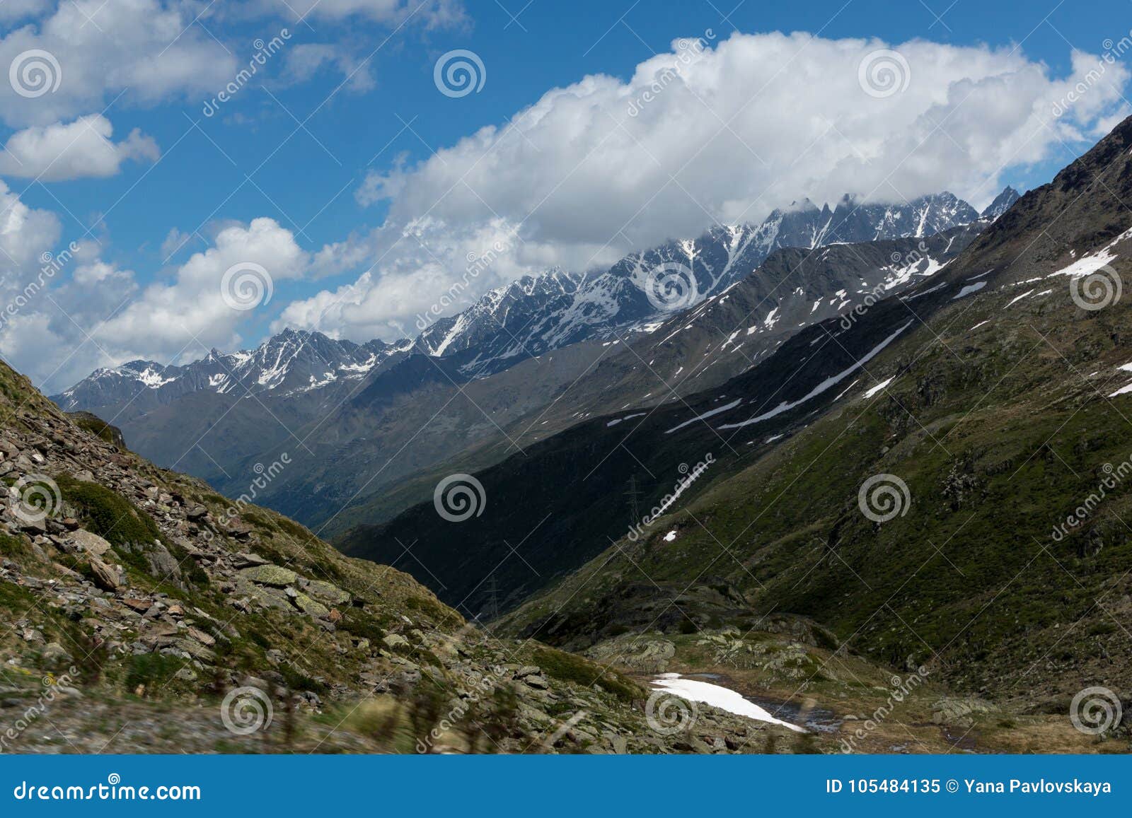 Beautiful Green Valley With Covered Snow Mountain Peaks Stock Image