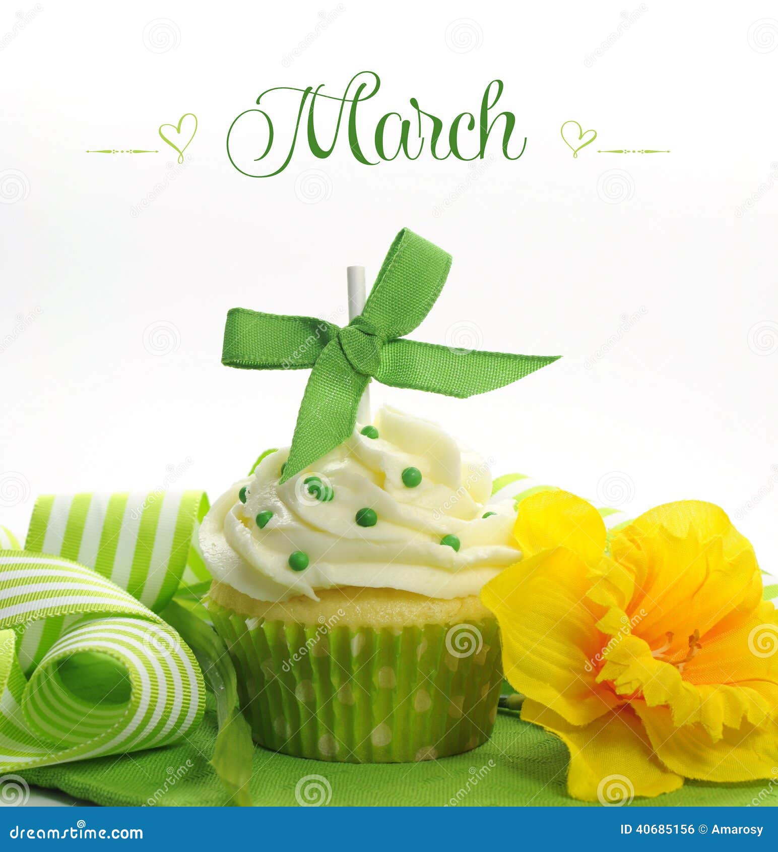 beautiful green and yellow spring theme cupcake with doffodils and decorations for the month of march