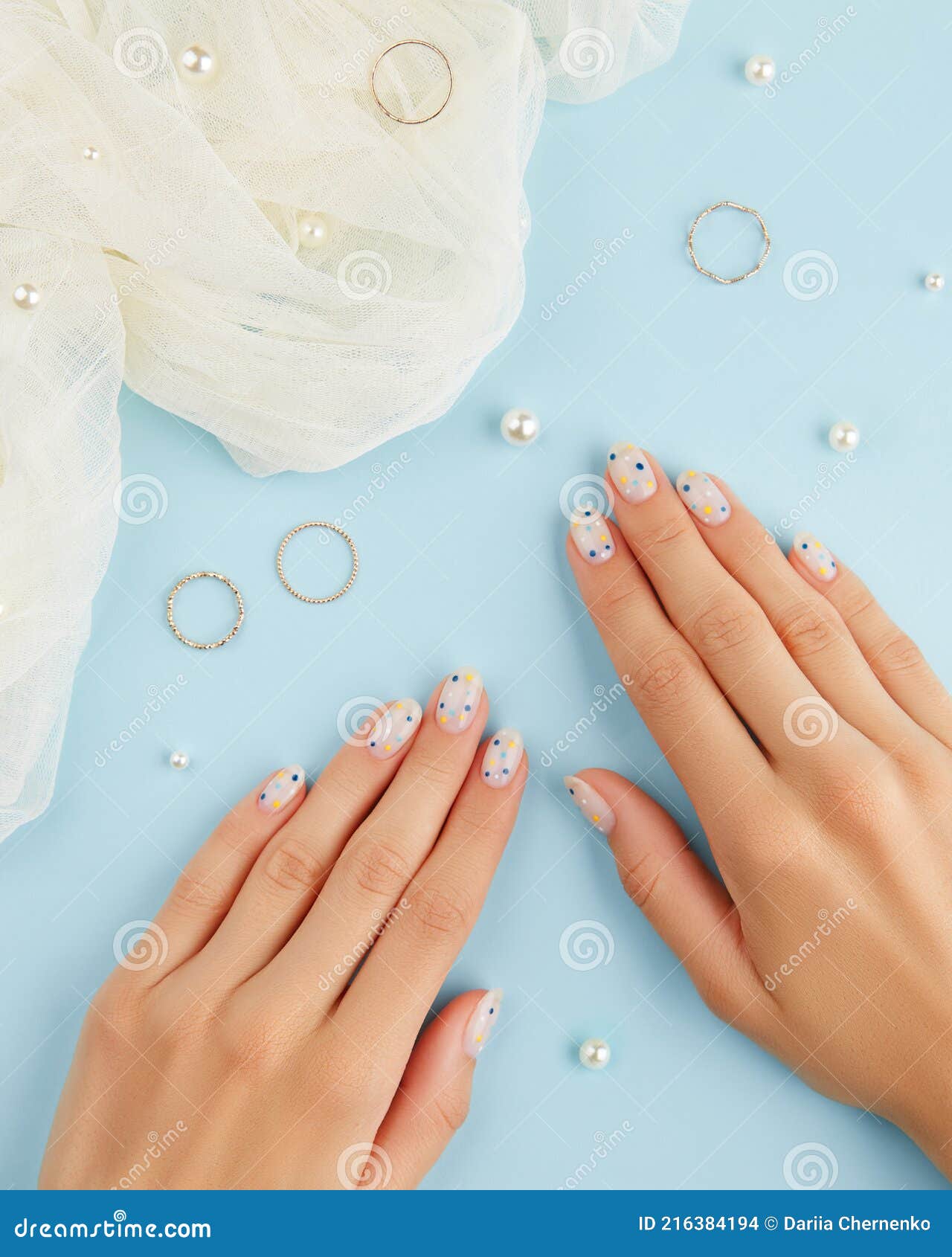 Elegant Summer Nail Designs with Blue, White, and Gold Glitter Polish