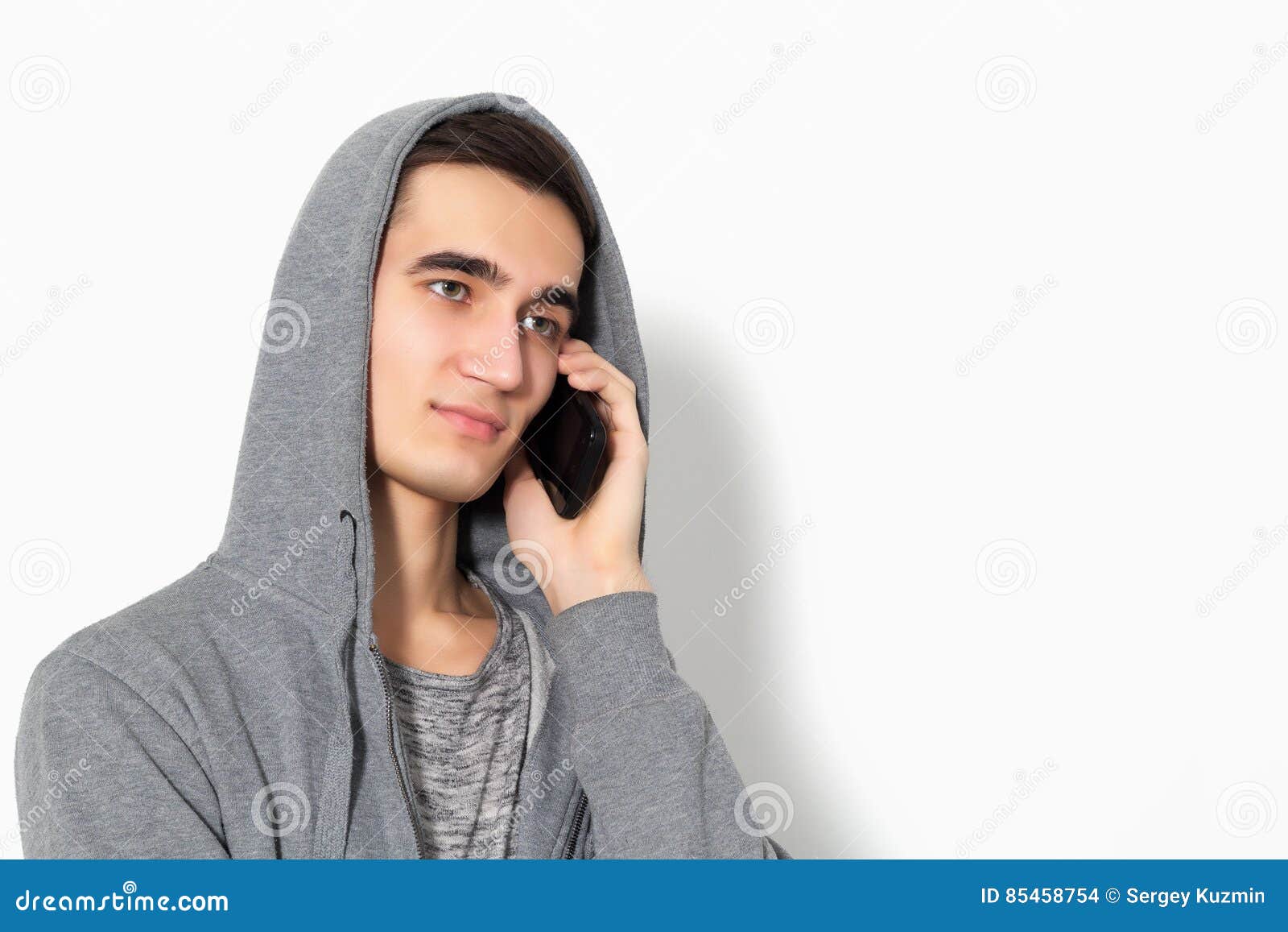 Beautiful Guy Talking on a Cell Phone. Stock Photo - Image of youth ...