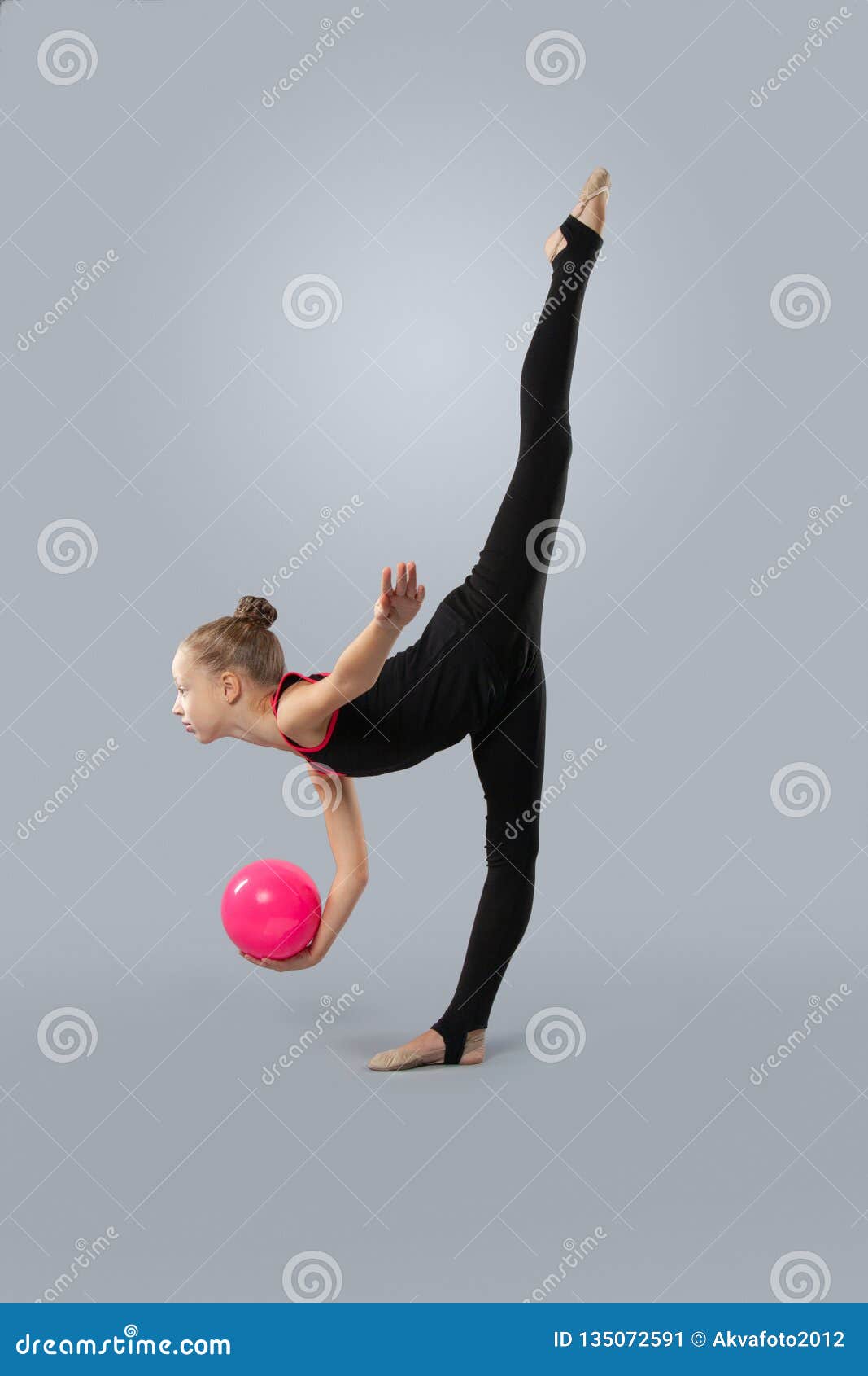 Beautiful Gymnast in Sports Outfit with a Ball Performs an Element of ...