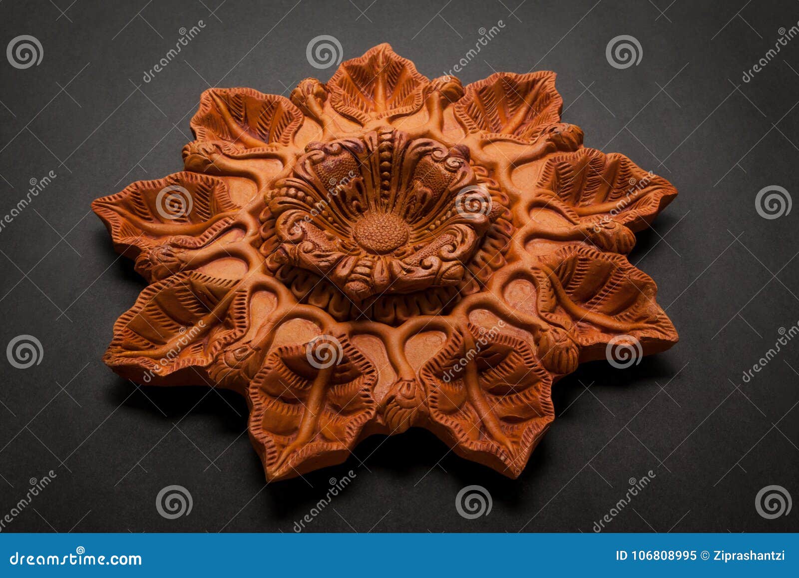 a beautiful handmade nine mouthed er clay lamp