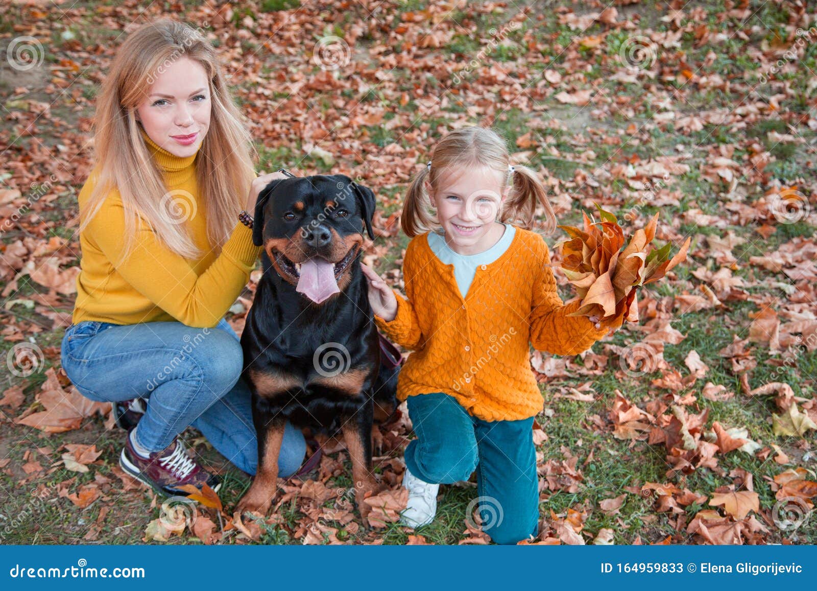 Beautiful Happy Family is Having Fun with Rottweiler Dog. Blonde Adorable  Mother and Daughter Embracing Their Dog. Stock Image - Image of enjoyment,  child: 164959833