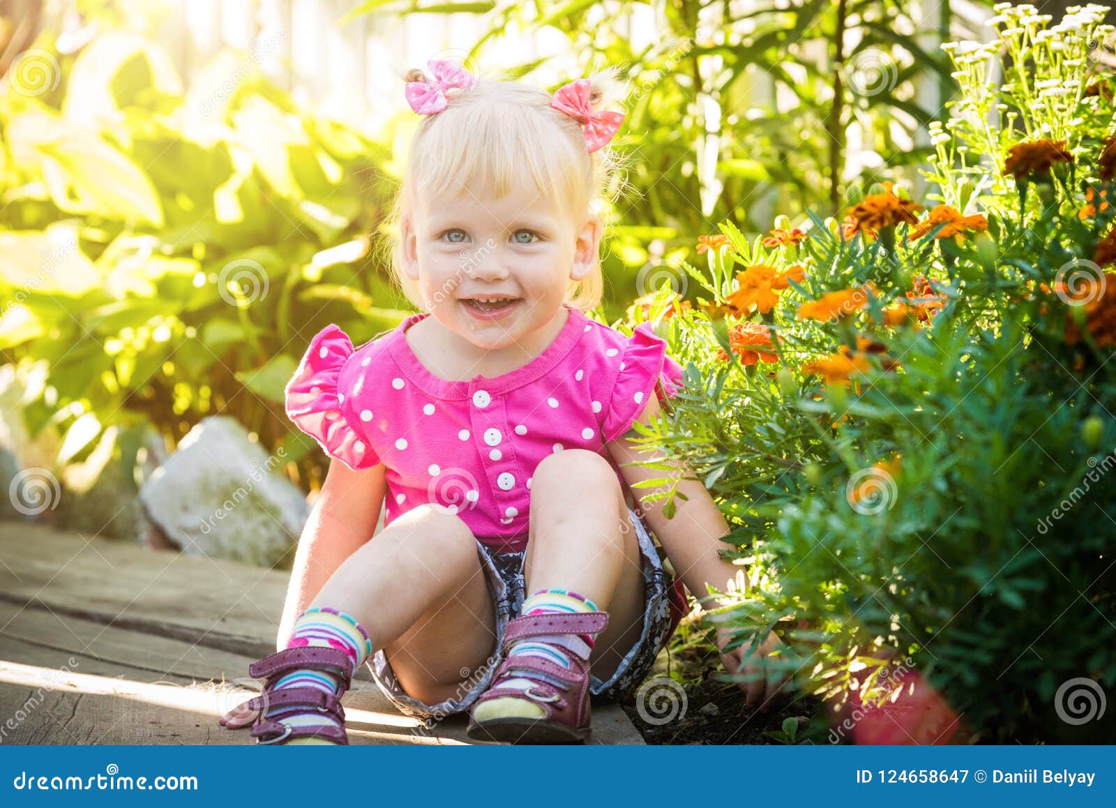 Beautiful Happy Little Baby Girl on a Green Bright Summer Background ...