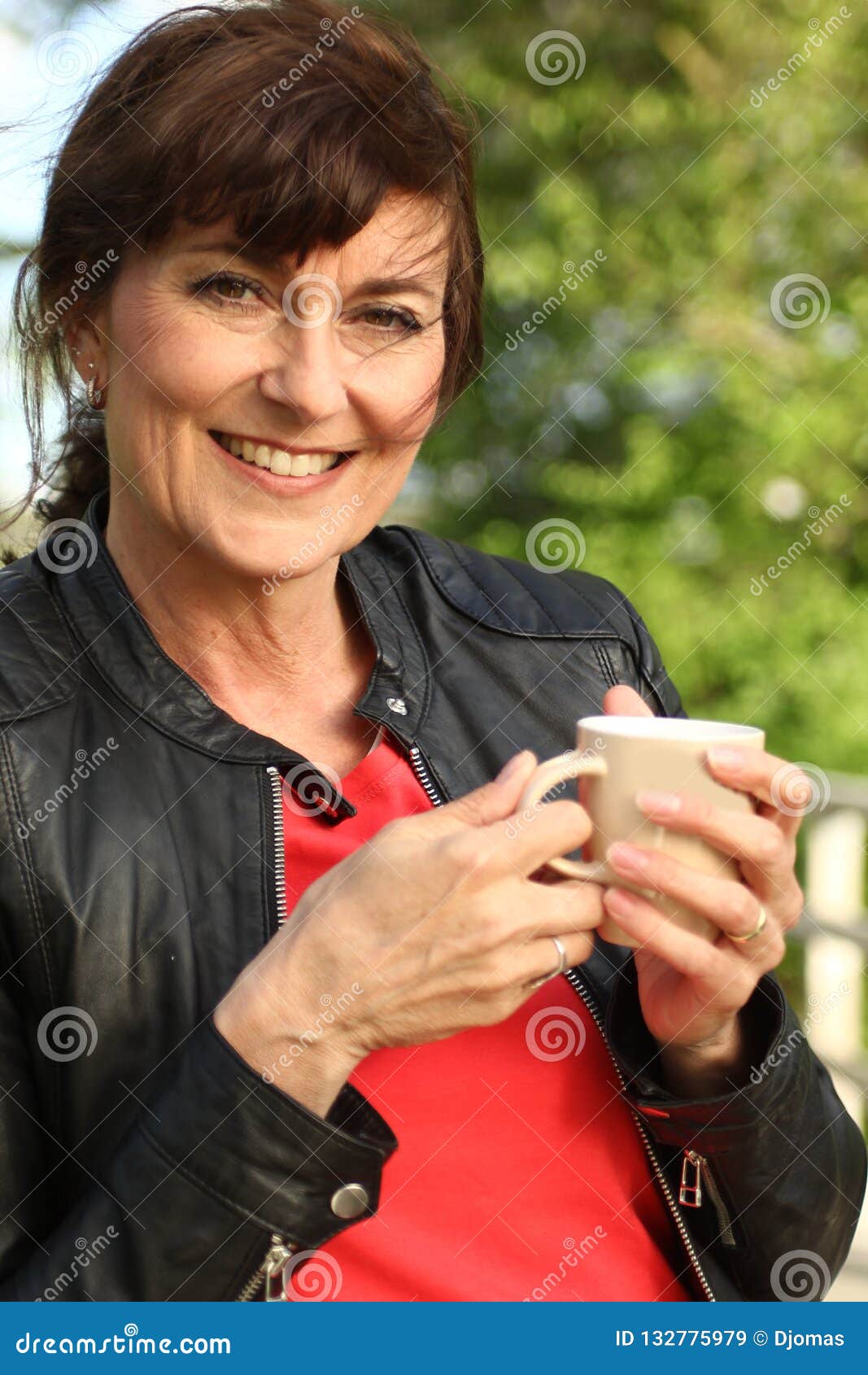 Beautiful Happy Mature Caucasian Woman Outside In The Park Stock Image