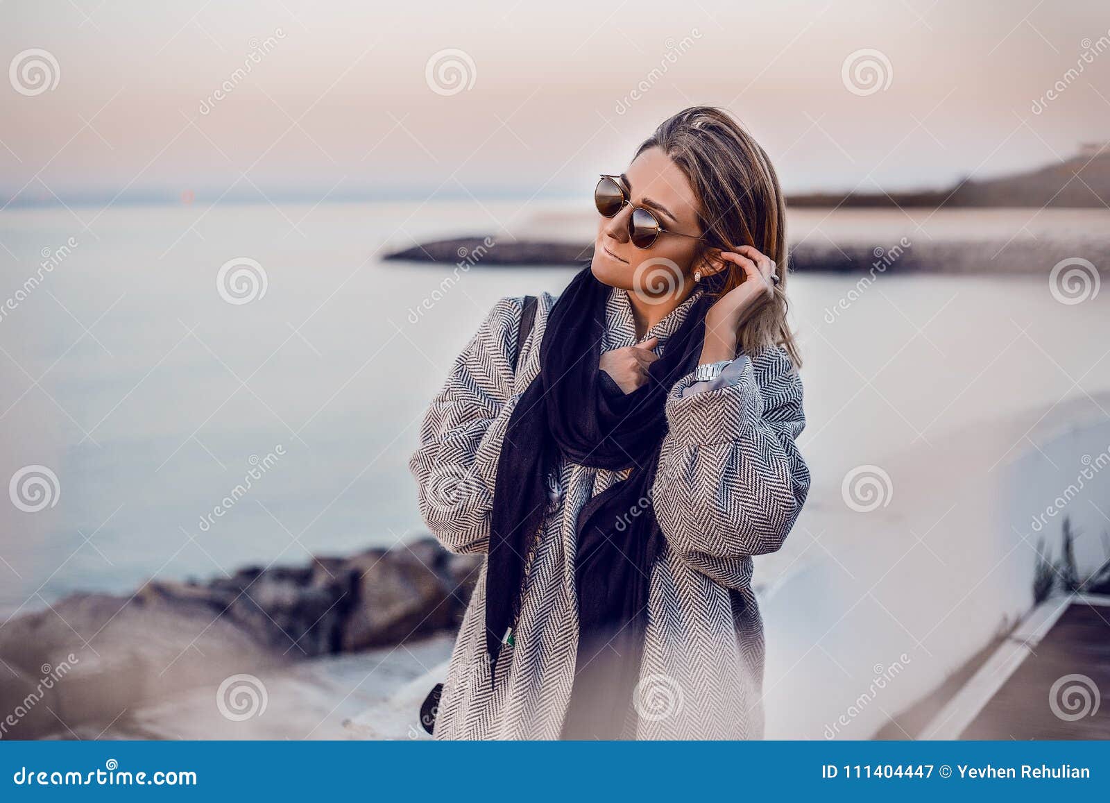 Beautiful Happy Woman In Sunglasses Standing At The Sea