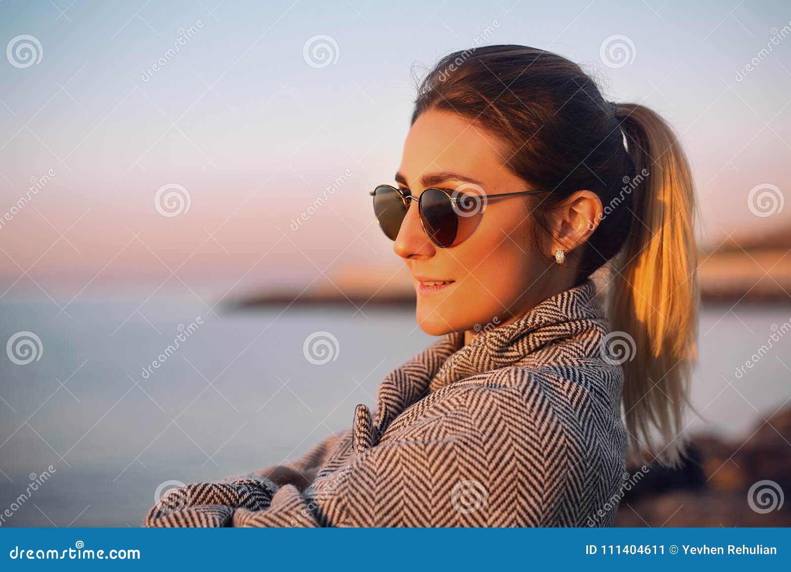 Beautiful Happy Woman In Sunglasses Standing At The Sea