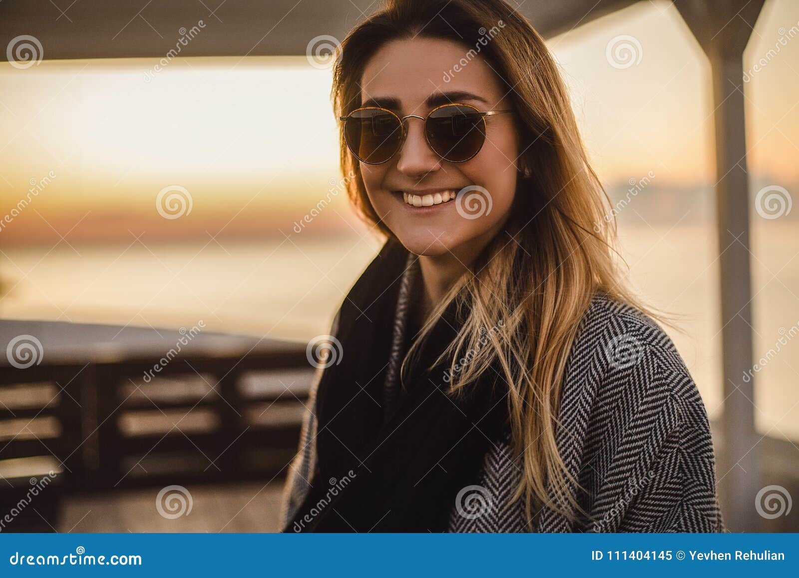 Beautiful Happy Woman In Sunglasses Standing At The Sea