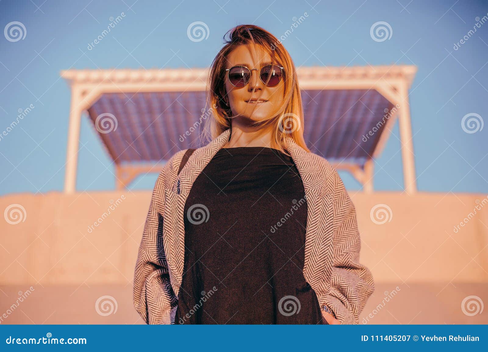 Beautiful Happy Woman In Sunglasses Standing At The Sea