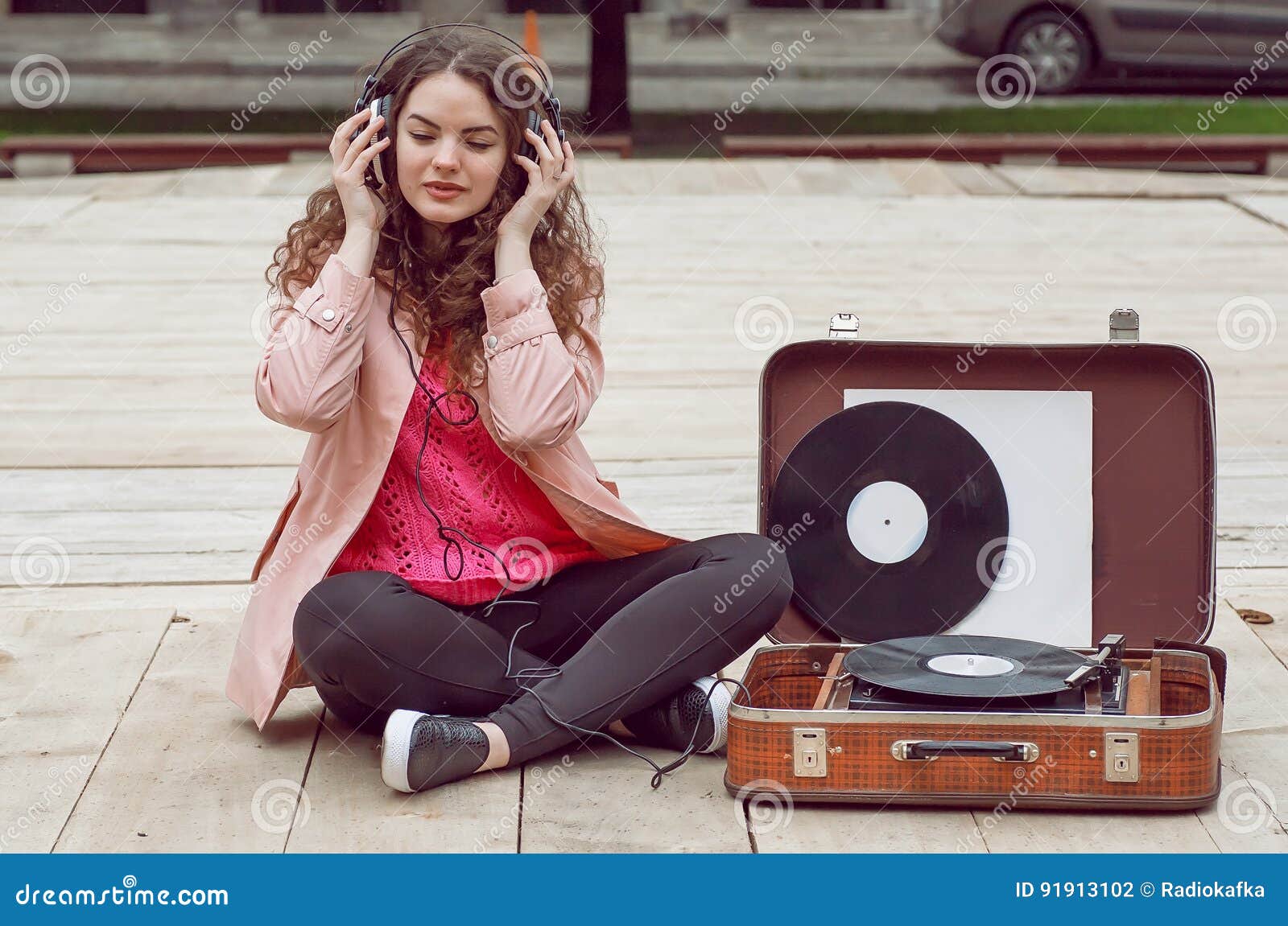 beautiful hipster girl with old vintage vinyl records. listen to music with emotions