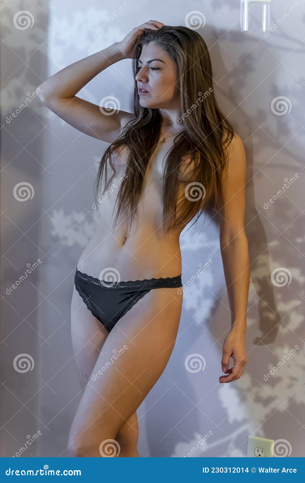 Gorgeous Hispanic Model Poses Nude in a Home Environment Stock Photo picture