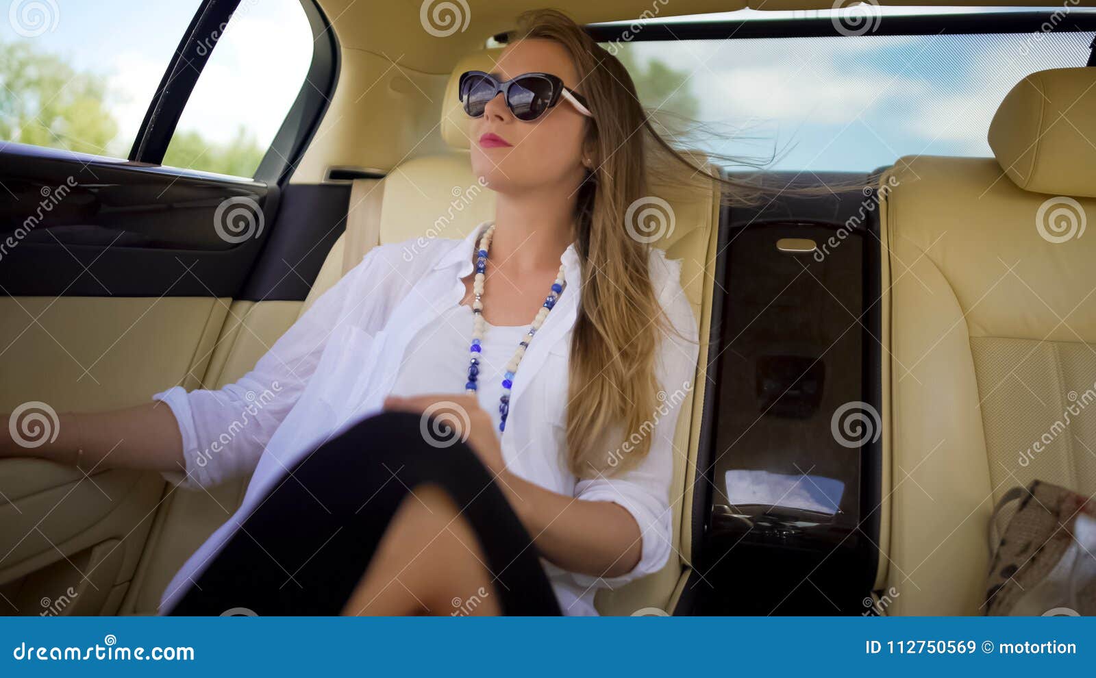 beautiful independent woman enjoying car trip on vacation, business traveler