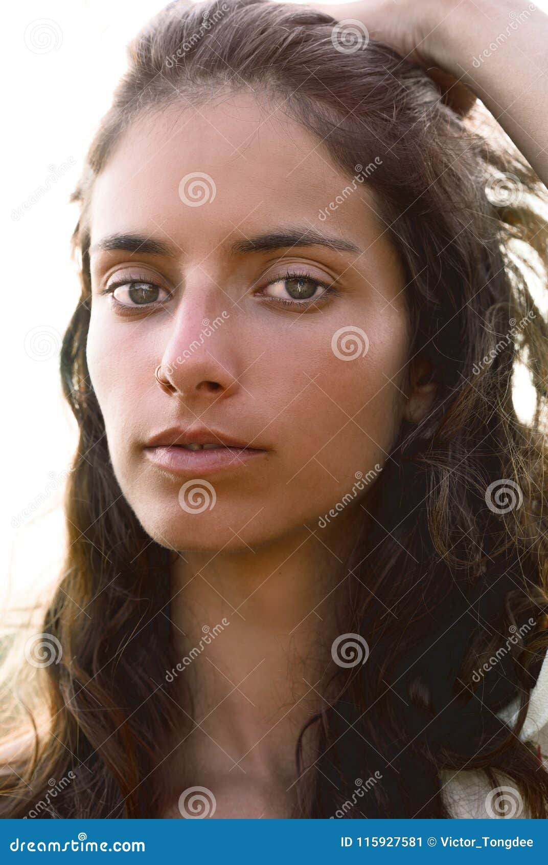 Portrait Of A Girl Sliding Her Hands Through Her Hair With Stock Image Image Of Natural Brown