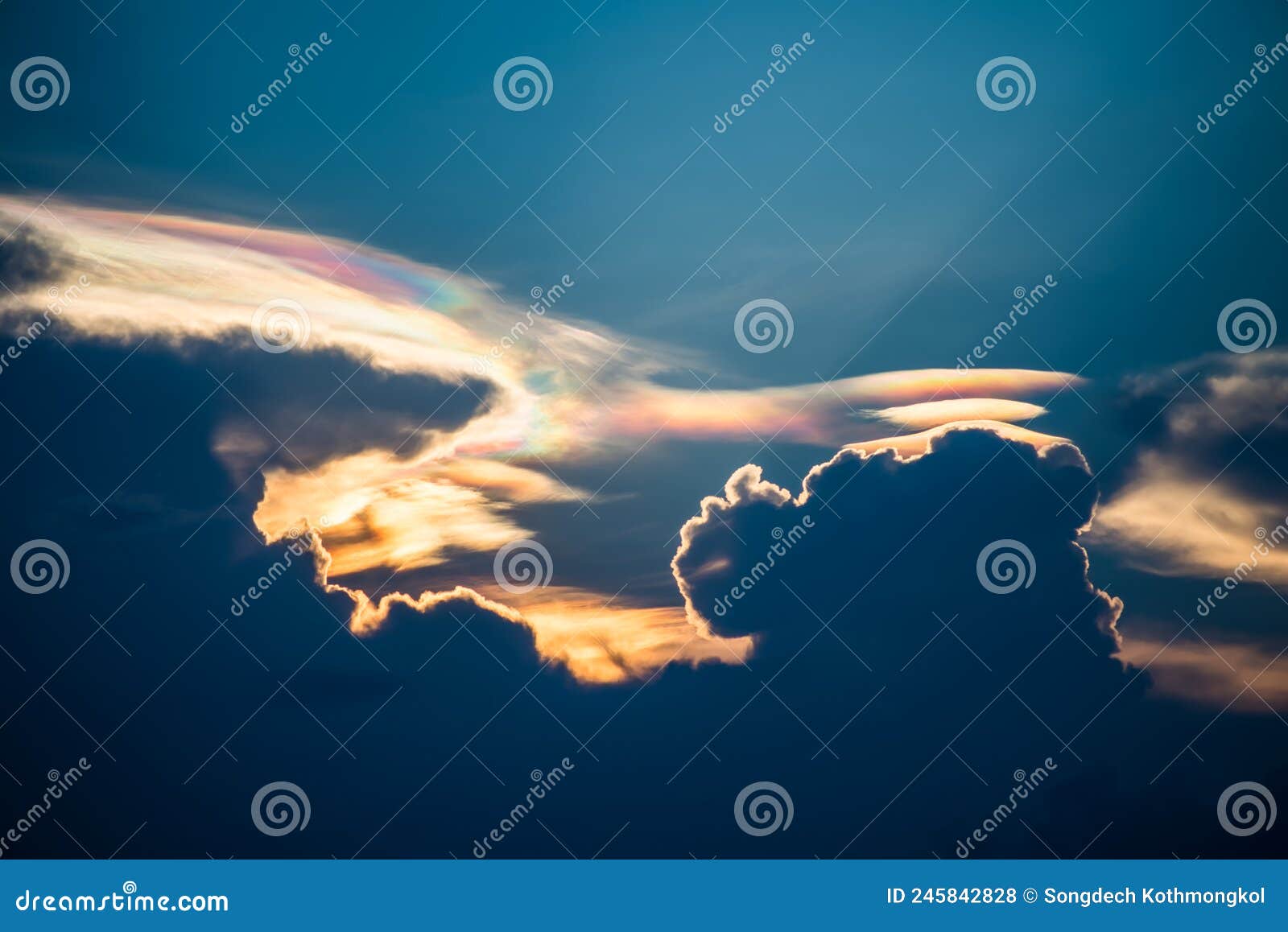 beautiful iridescent cloud, irisation or rainbow cloud on sky