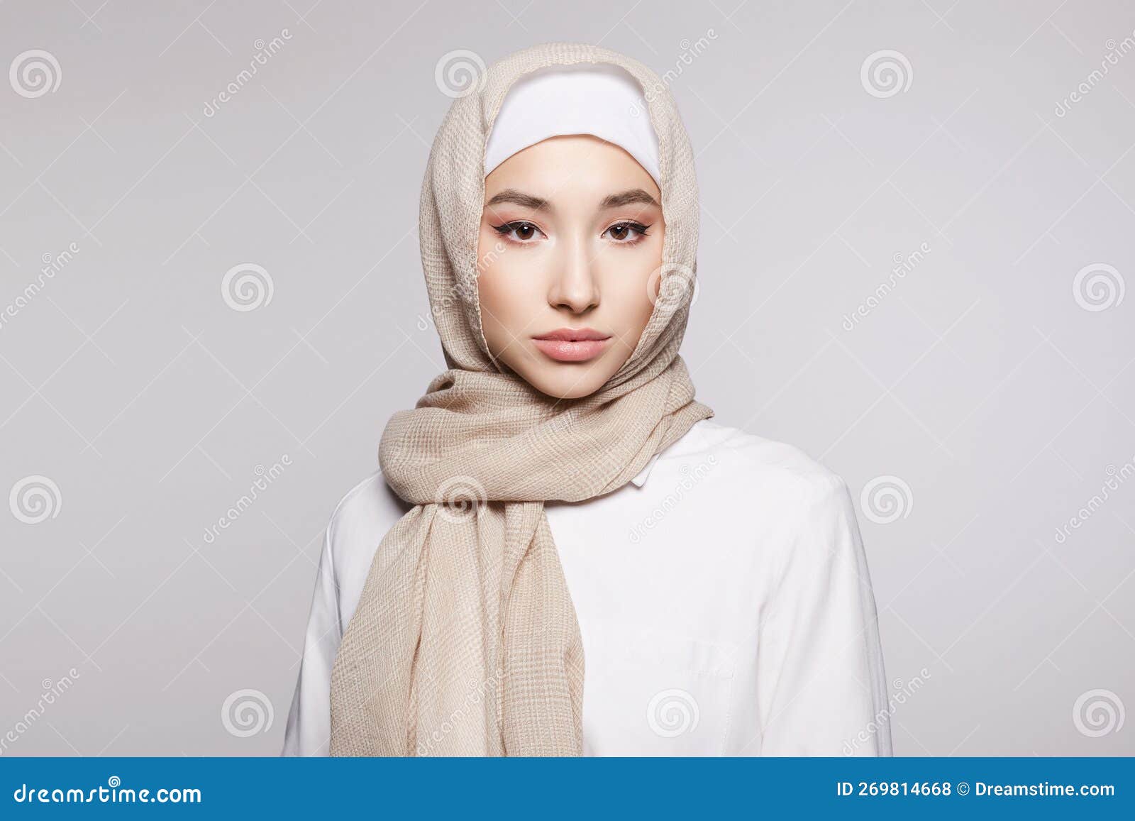 beautiful islamic young woman with make-up. beauty girl in hija