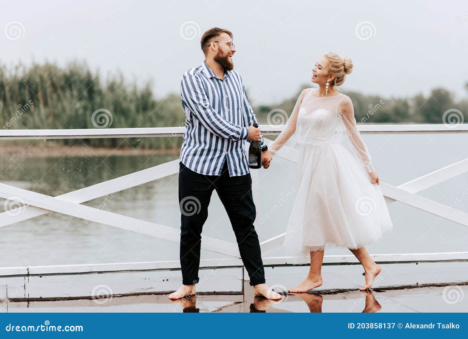 Beautiful Just Married Dance Barefoot And Have Fun On The Pier By The Water Stock Image Image 