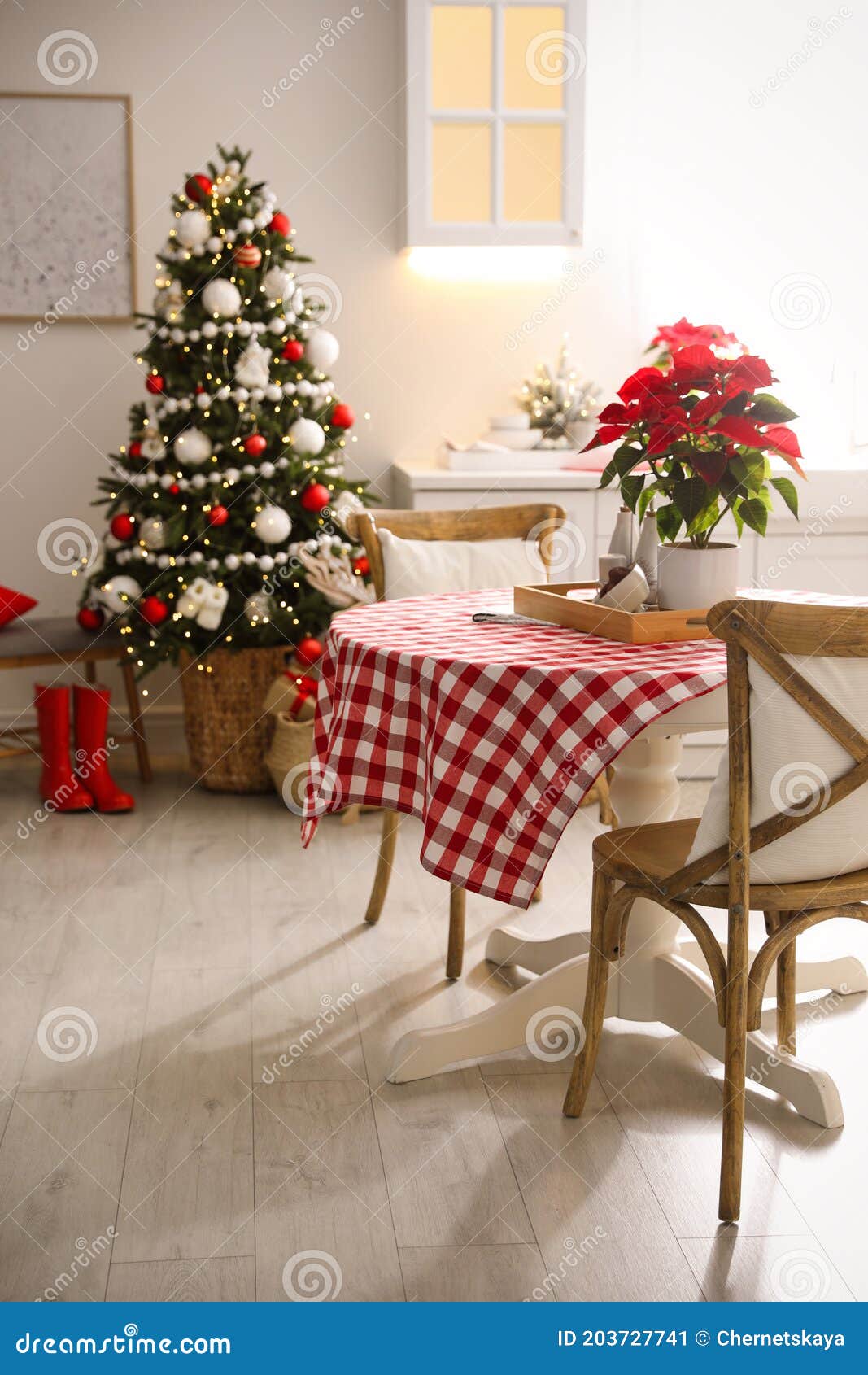 Beautiful Kitchen Interior with Christmas Tree and Festive Decor Stock